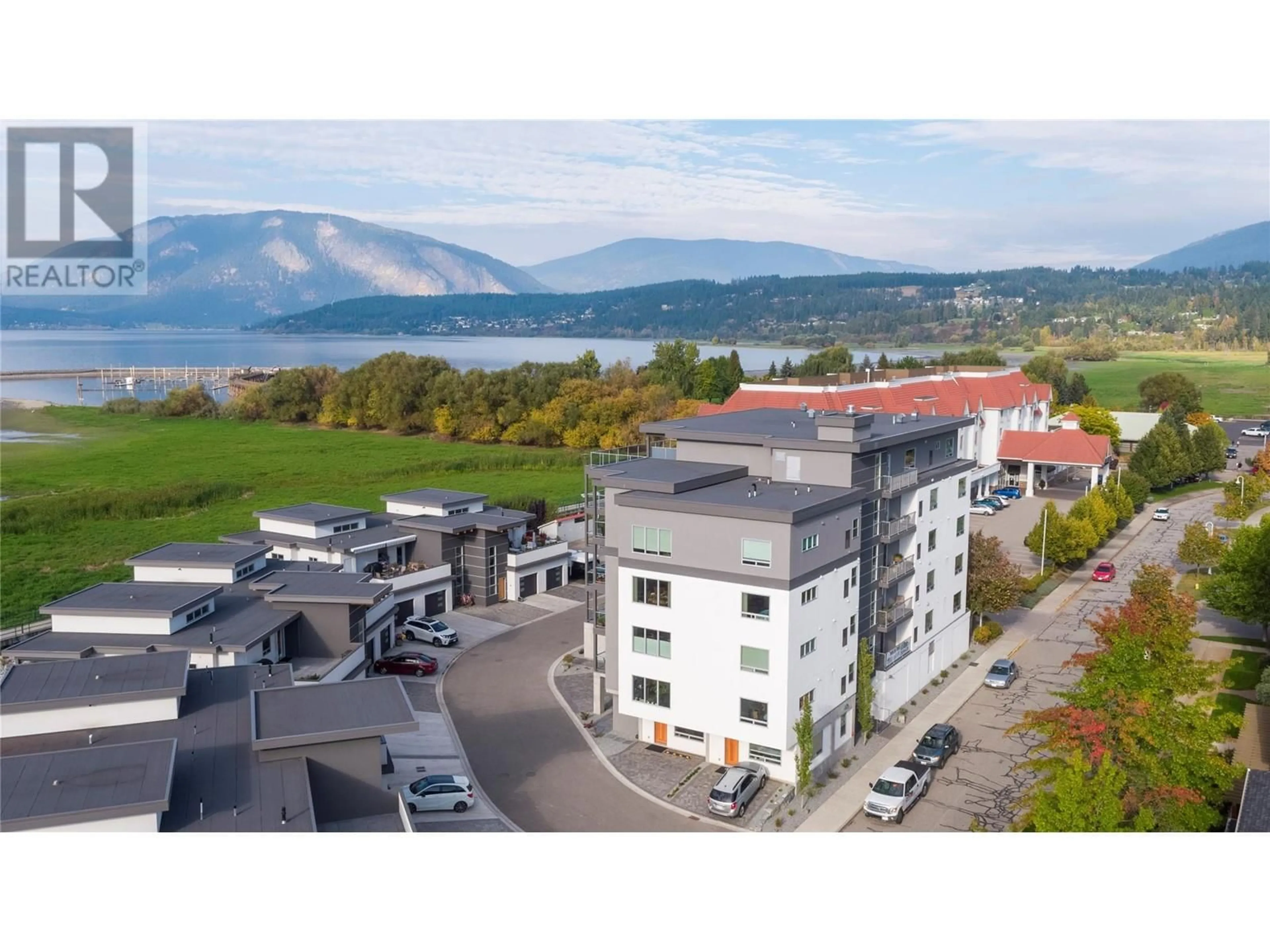 A pic from outside/outdoor area/front of a property/back of a property/a pic from drone, mountain view for 131 Harbourfront Drive NE Unit# 202, Salmon Arm British Columbia V1E0G4