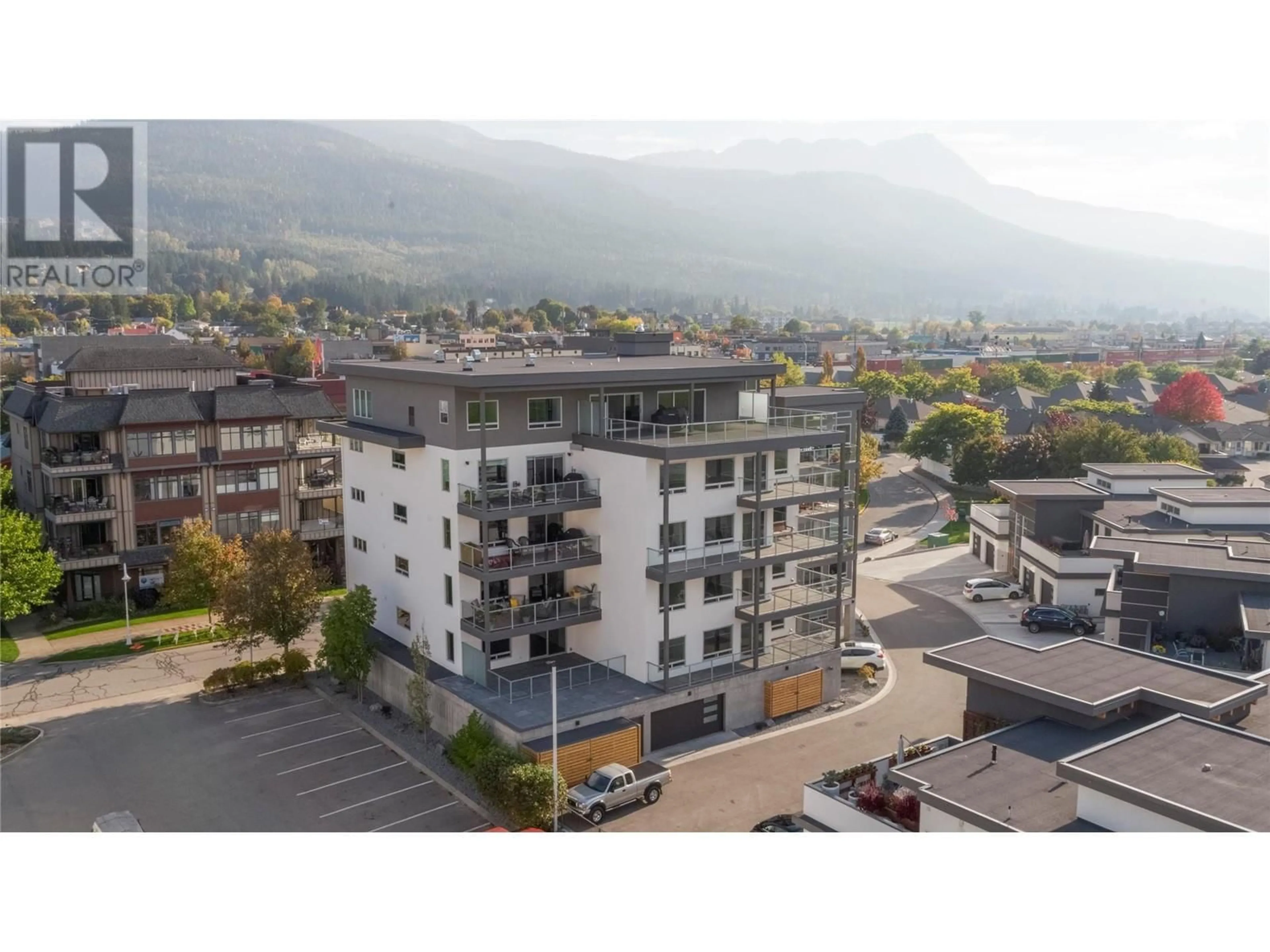 A pic from outside/outdoor area/front of a property/back of a property/a pic from drone, mountain view for 131 Harbourfront Drive NE Unit# 202, Salmon Arm British Columbia V1E0G4