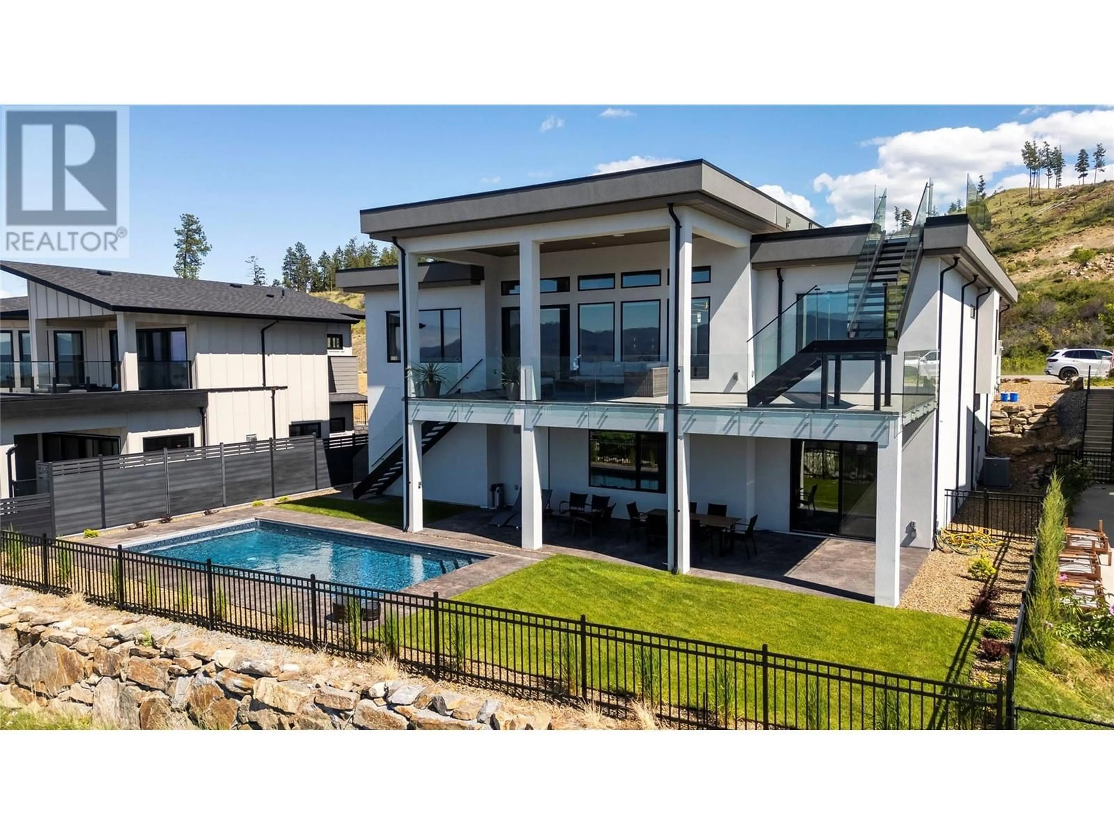 A pic from outside/outdoor area/front of a property/back of a property/a pic from drone, unknown for 5546 Upper Mission Drive, Kelowna British Columbia V1W5M4