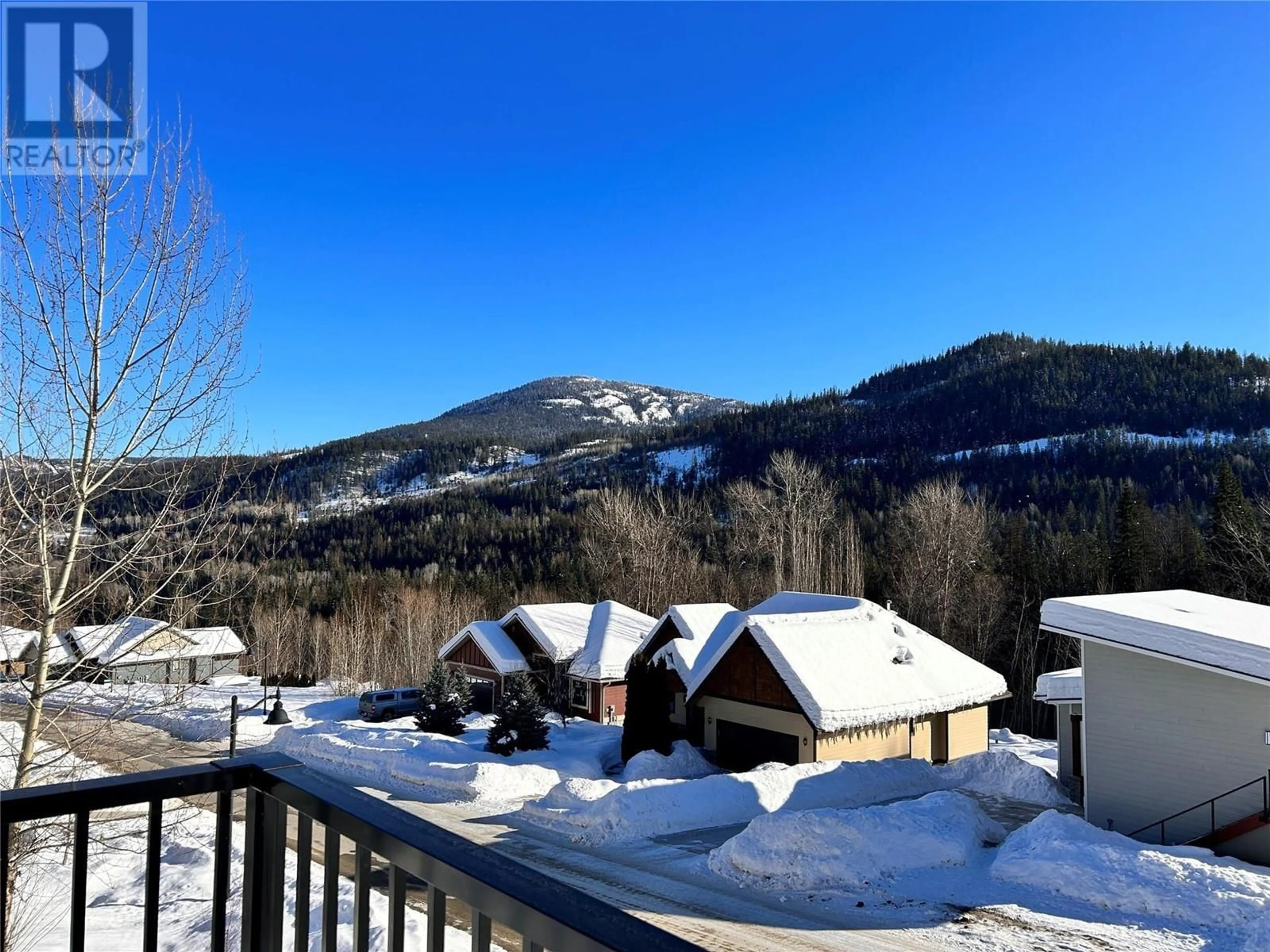 A pic from outside/outdoor area/front of a property/back of a property/a pic from drone, mountain view for 908 Redstone Drive, Rossland British Columbia V0G1Y0