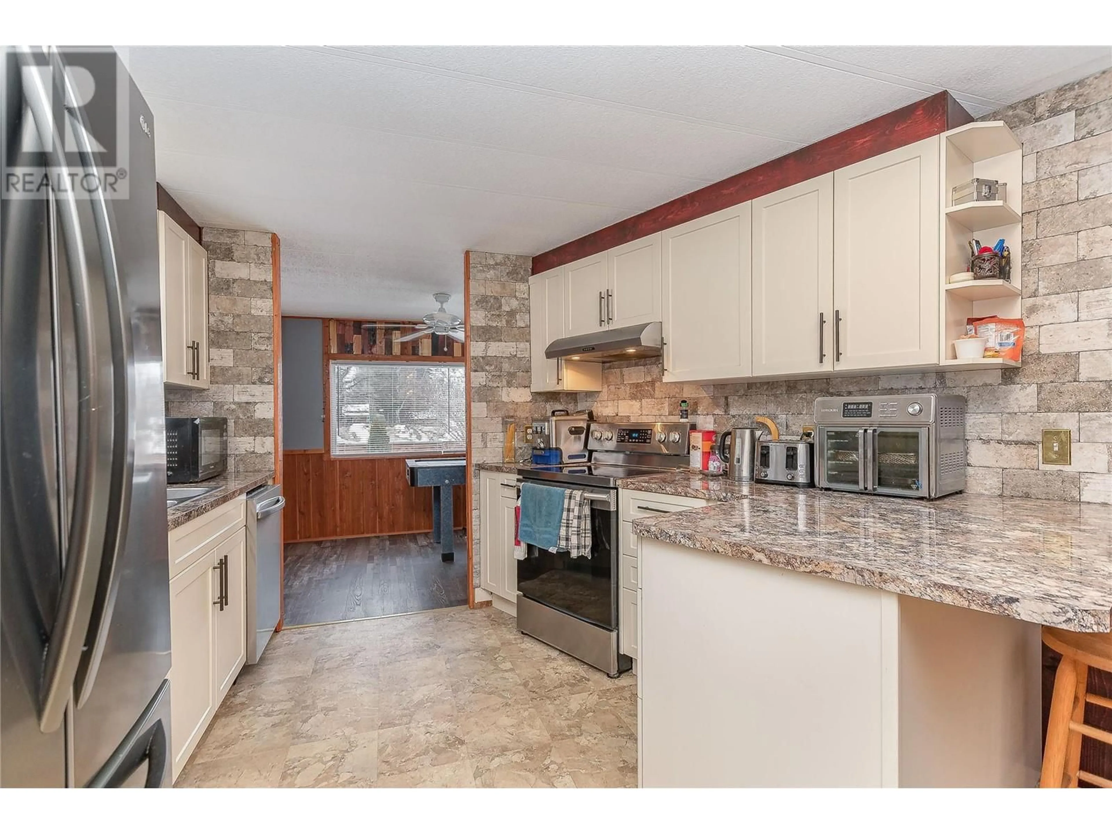 Open concept kitchen, ceramic/tile floor for 501 Kappel Street Unit# 1, Sicamous British Columbia V0E2V1