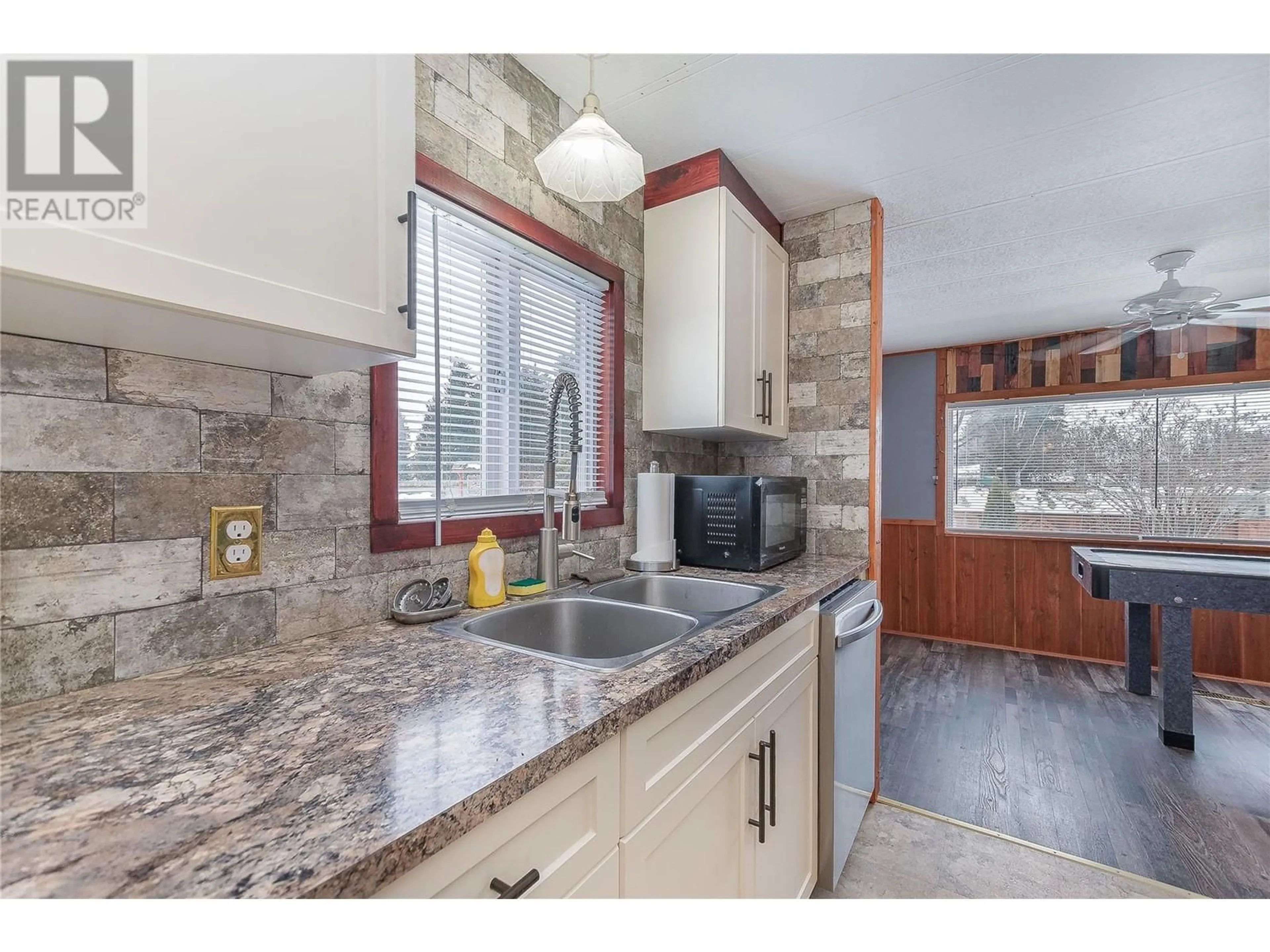 Open concept kitchen, ceramic/tile floor for 501 Kappel Street Unit# 1, Sicamous British Columbia V0E2V1