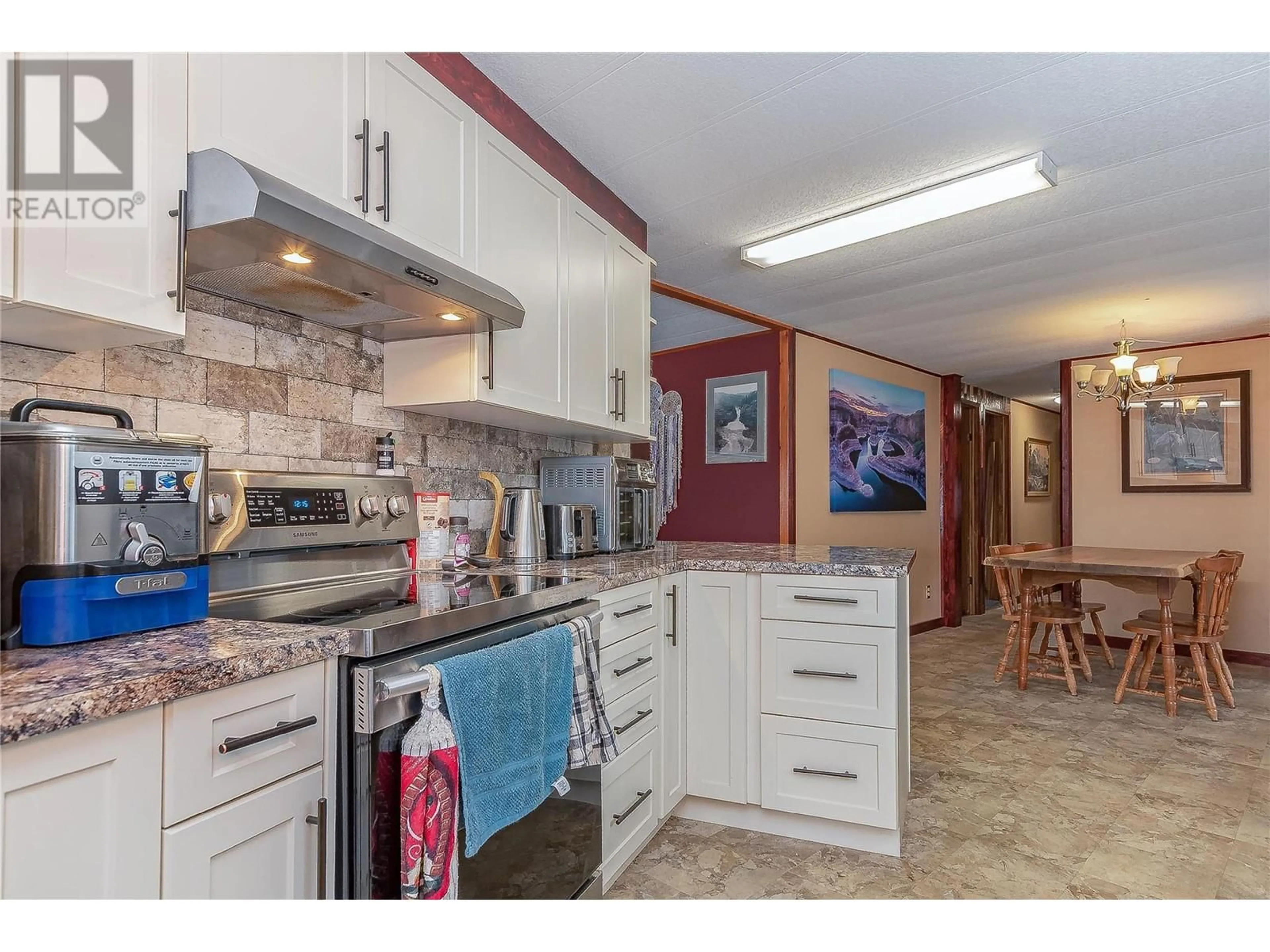 Open concept kitchen, ceramic/tile floor for 501 Kappel Street Unit# 1, Sicamous British Columbia V0E2V1