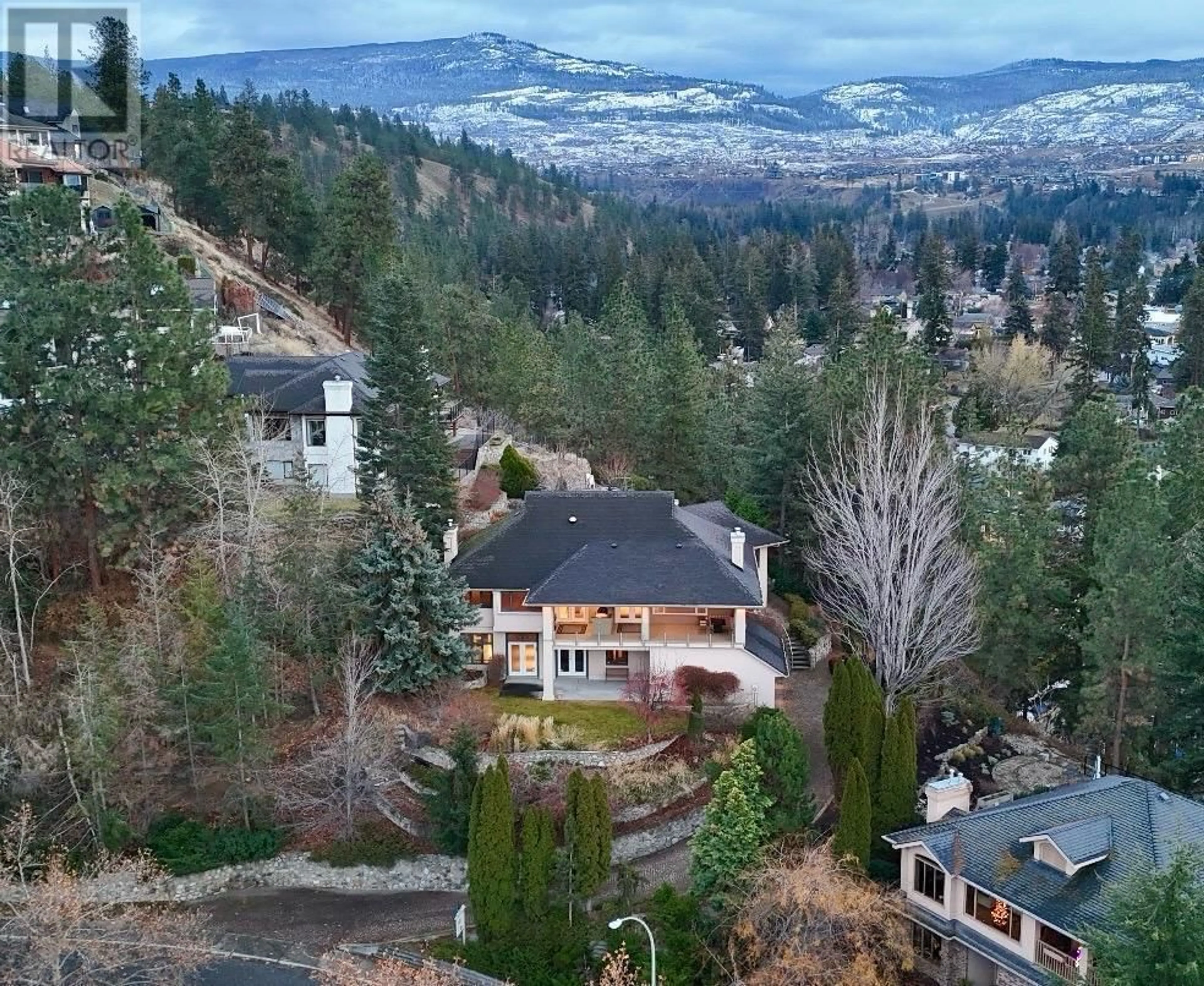 A pic from outside/outdoor area/front of a property/back of a property/a pic from drone, mountain view for 765 Westpoint Drive, Kelowna British Columbia V1W2Z4