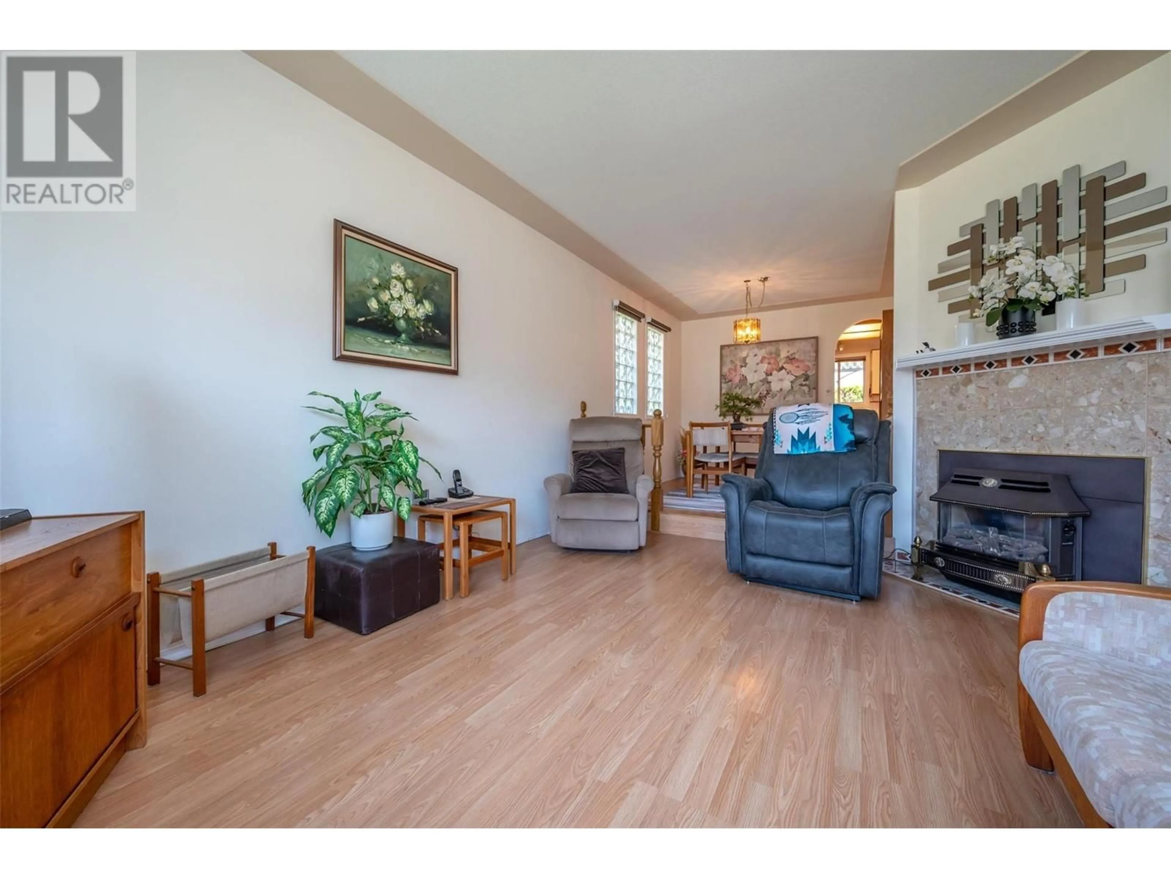 Living room with furniture, wood/laminate floor for 3400 Wilson Street Unit# 141, Penticton British Columbia V2A8H9