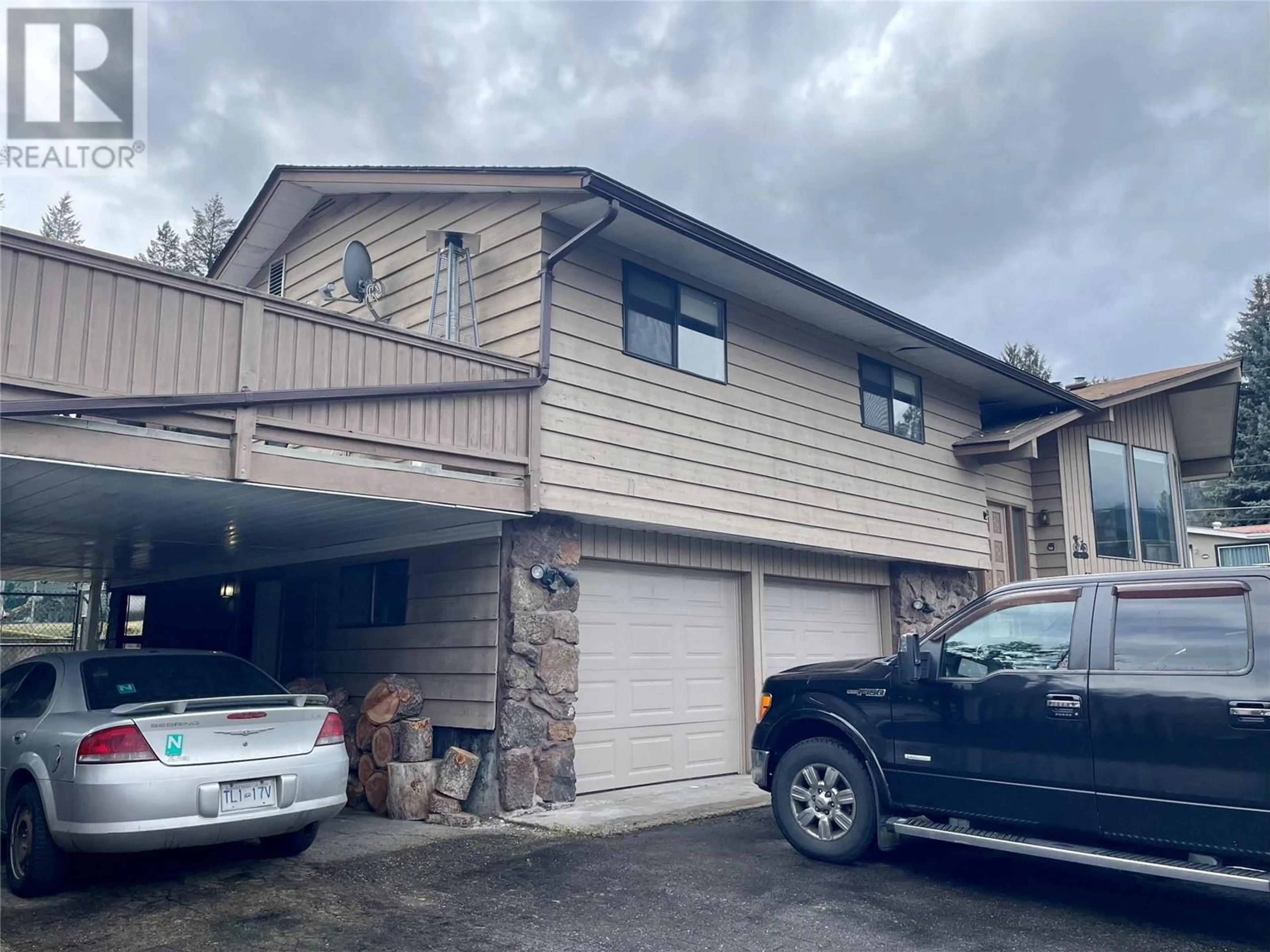 Home with vinyl exterior material, street for 93 HOLMES ROAD, Christina Lake British Columbia V0H1E0
