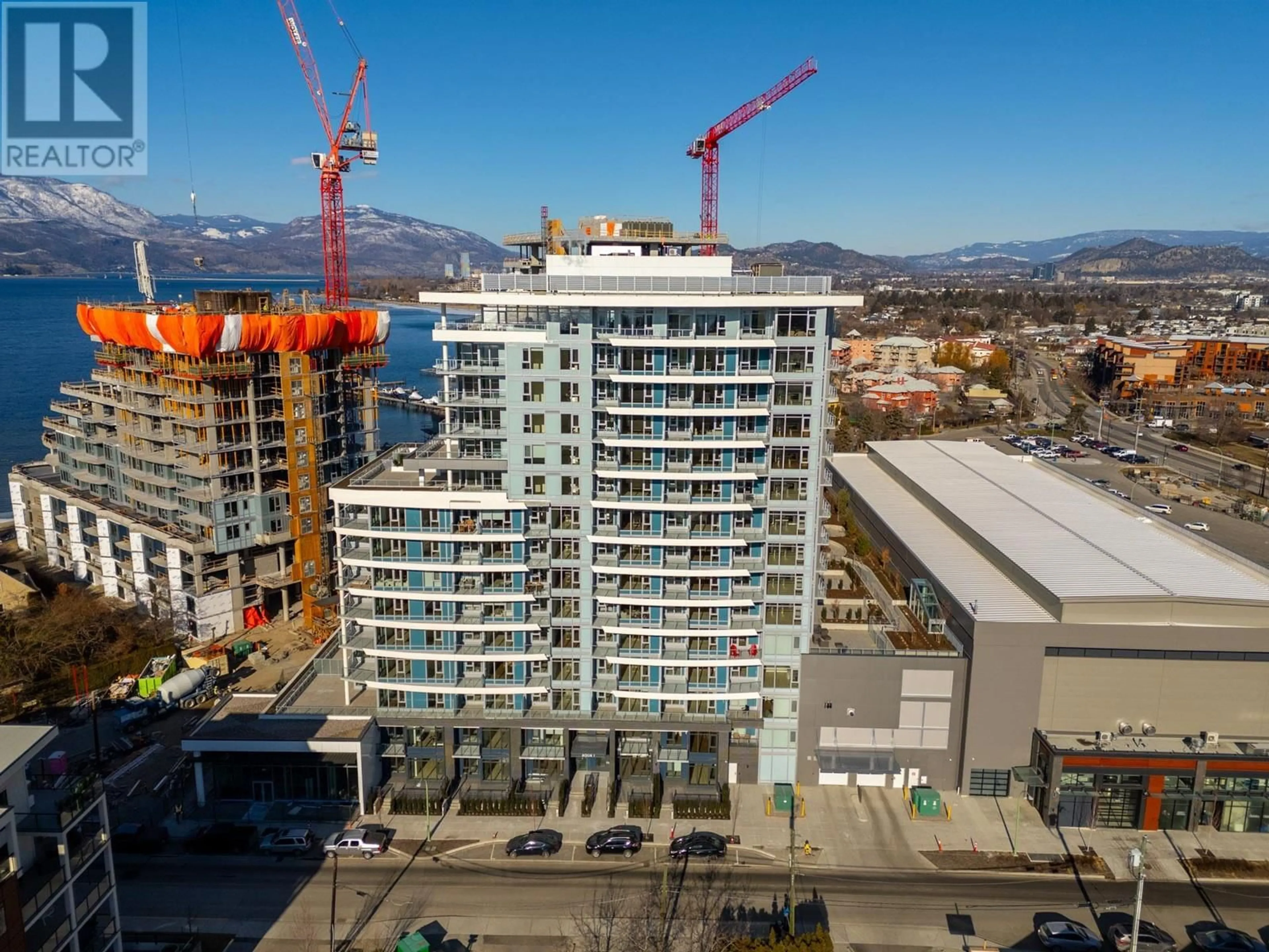 A pic from outside/outdoor area/front of a property/back of a property/a pic from drone, city buildings view from balcony for 607 - 3699 CAPOZZI ROAD, Kelowna British Columbia V1W0G3