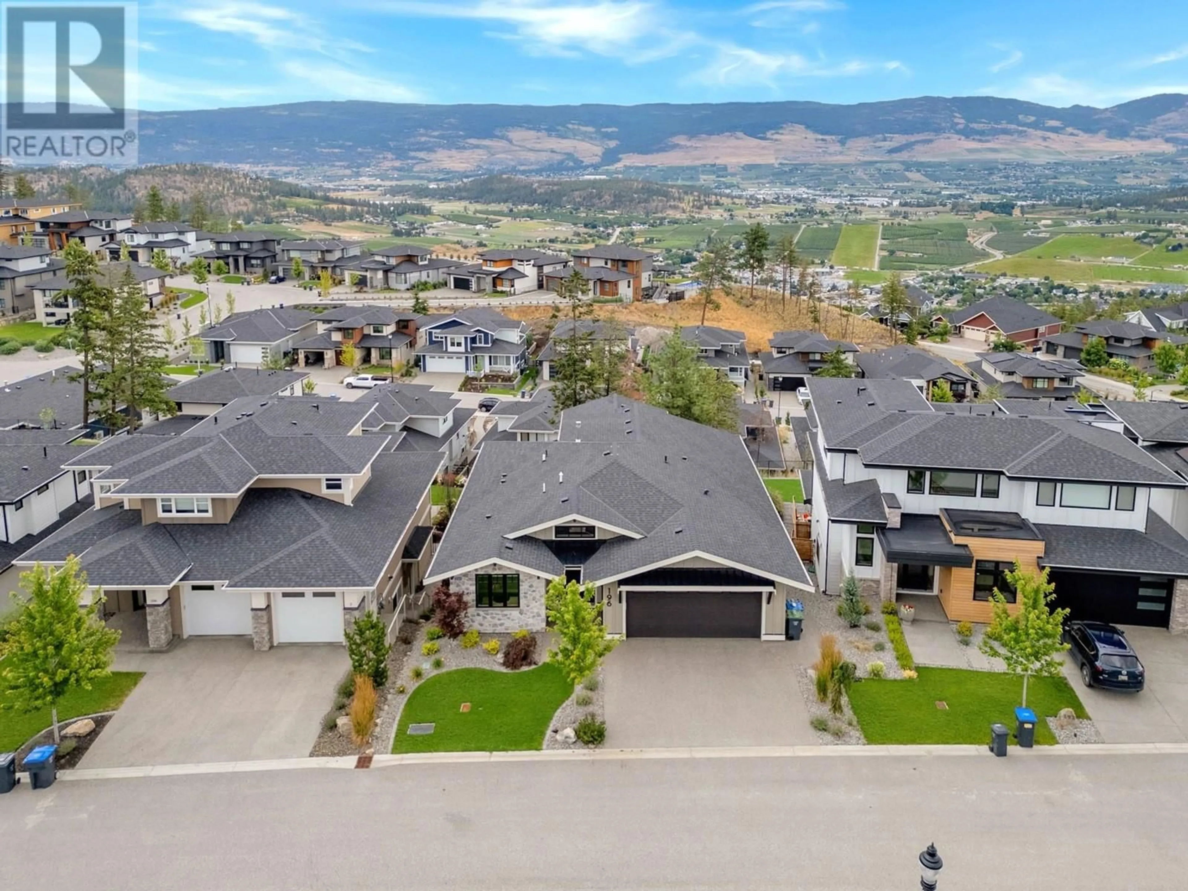 A pic from outside/outdoor area/front of a property/back of a property/a pic from drone, mountain view for 196 Summer Wood Drive, Kelowna British Columbia V1V2Z9