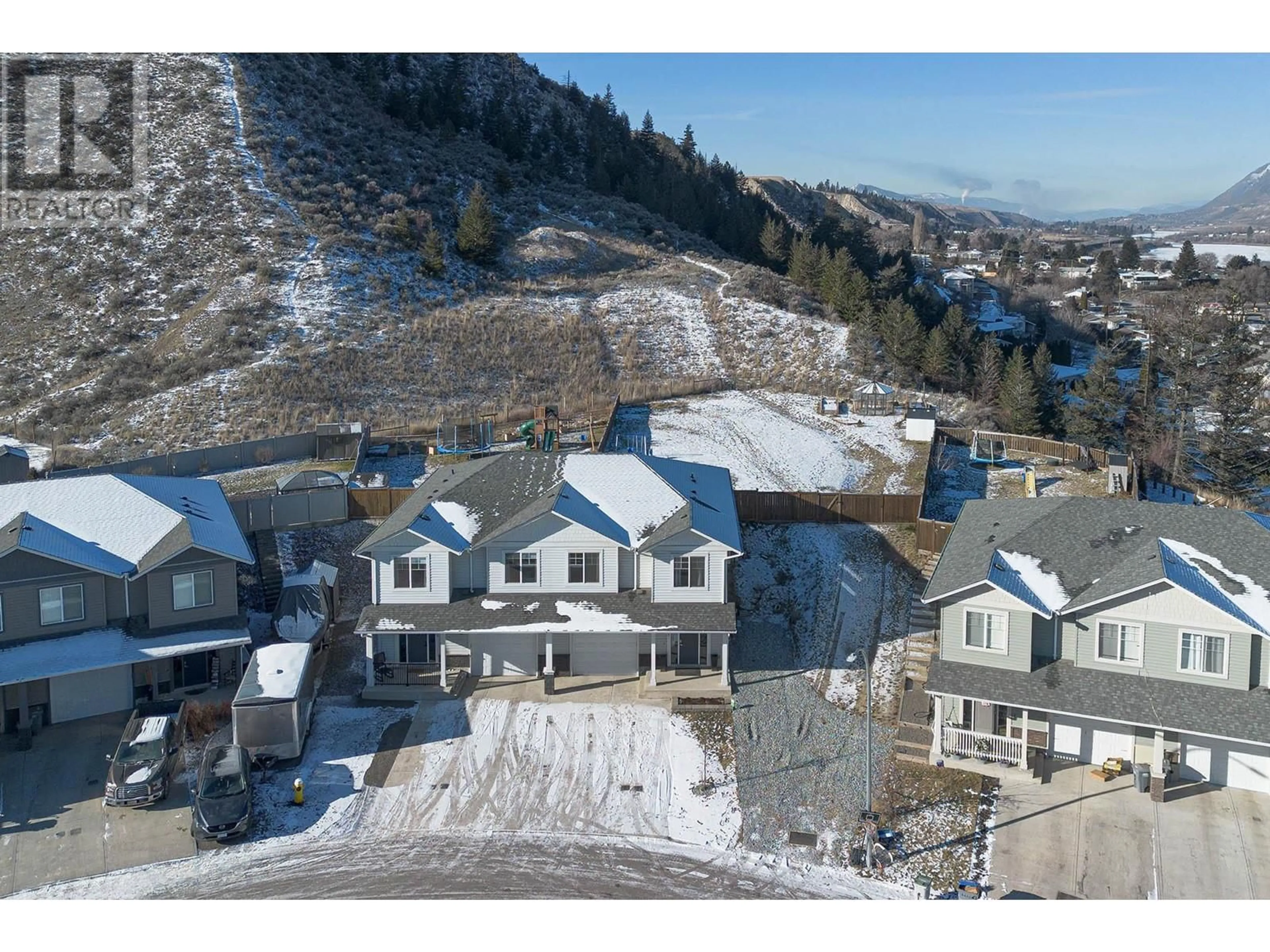 A pic from outside/outdoor area/front of a property/back of a property/a pic from drone, mountain view for 393 WING Place, Kamloops British Columbia V2C0H2