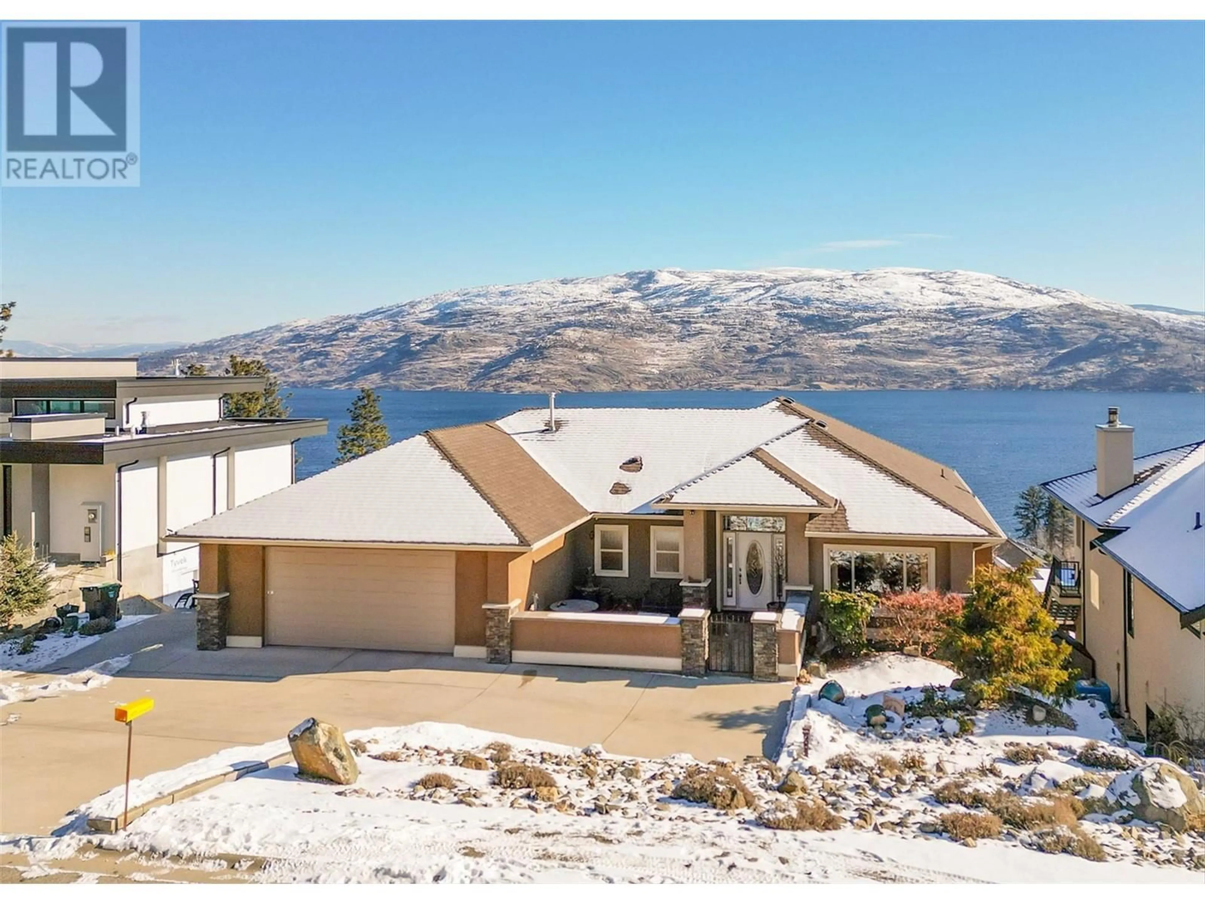 A pic from outside/outdoor area/front of a property/back of a property/a pic from drone, water/lake/river/ocean view for 6469 Bulyea Avenue, Peachland British Columbia V0H1X7