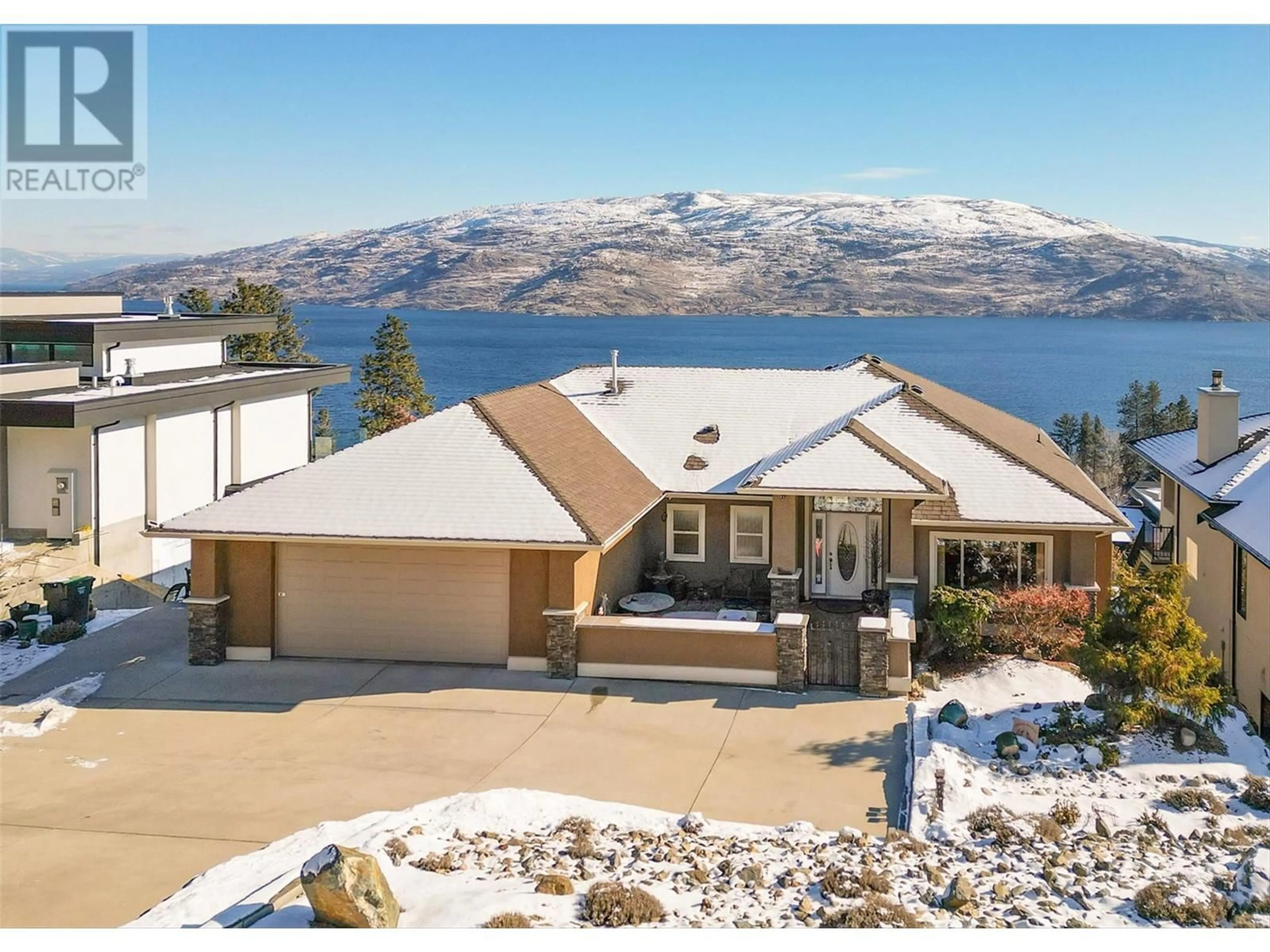 A pic from outside/outdoor area/front of a property/back of a property/a pic from drone, water/lake/river/ocean view for 6469 Bulyea Avenue, Peachland British Columbia V0H1X7