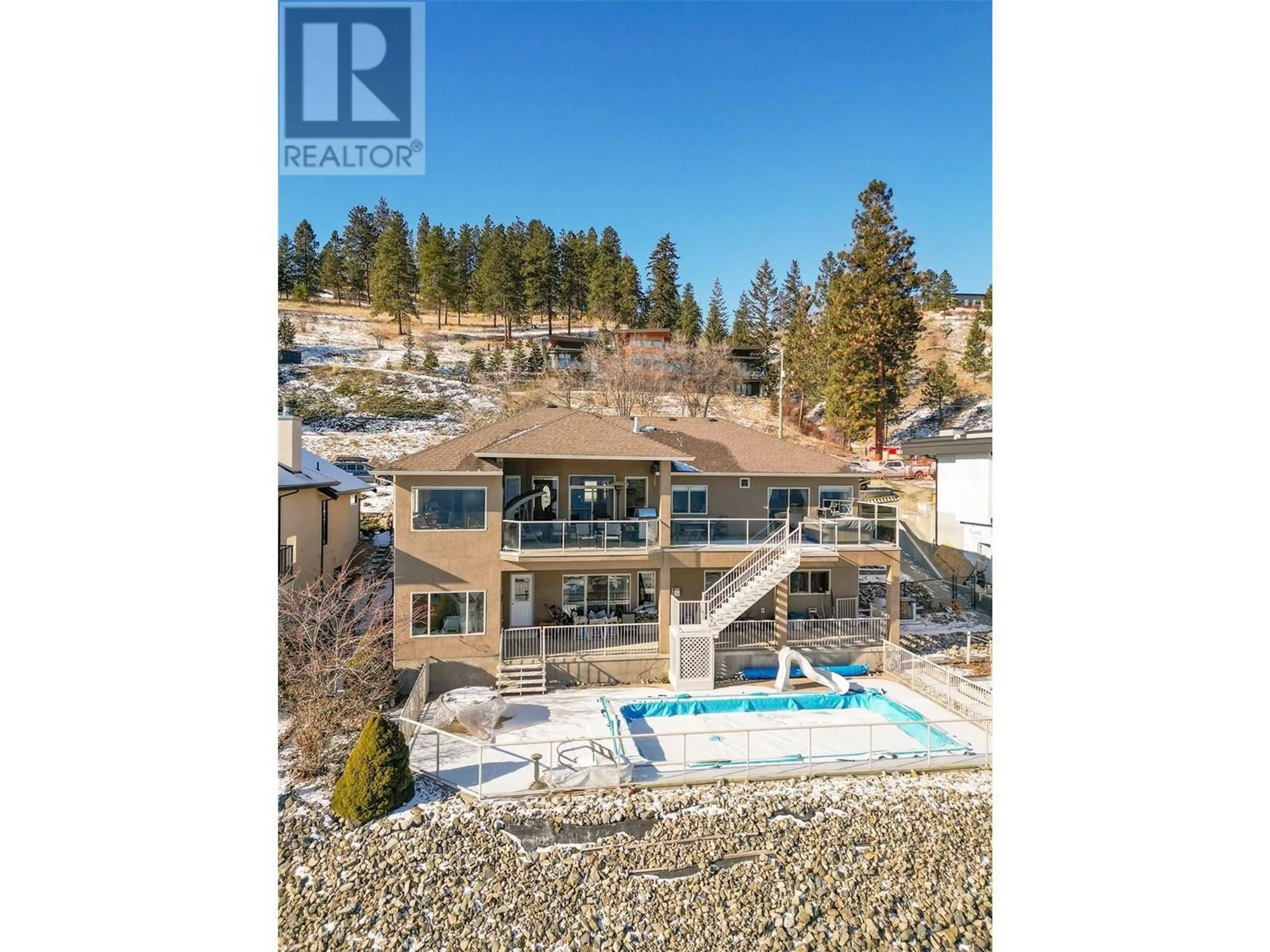 A pic from outside/outdoor area/front of a property/back of a property/a pic from drone, water/lake/river/ocean view for 6469 Bulyea Avenue, Peachland British Columbia V0H1X7