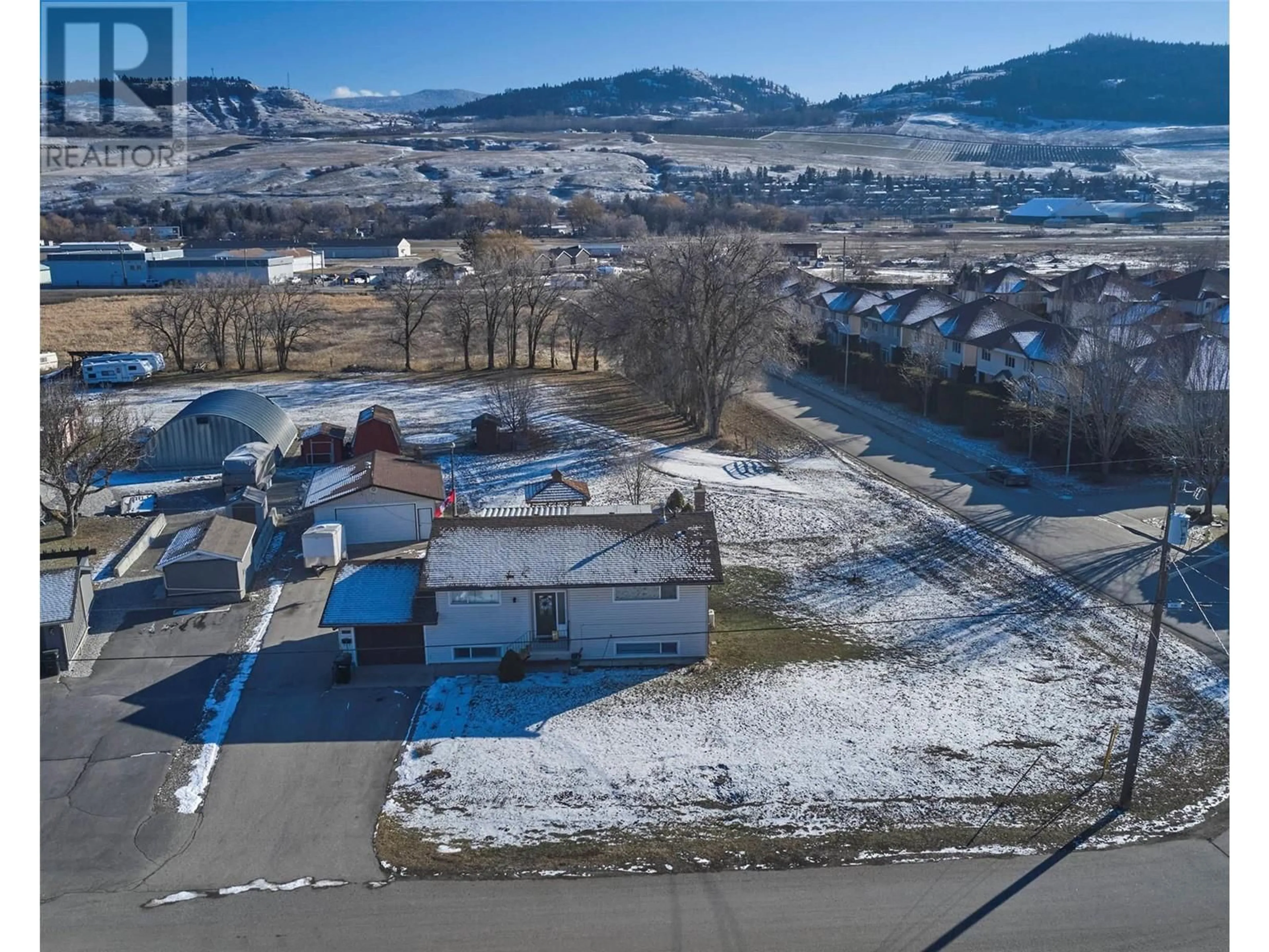 A pic from outside/outdoor area/front of a property/back of a property/a pic from drone, unknown for 6576 Scott Road, Vernon British Columbia V1H1N7