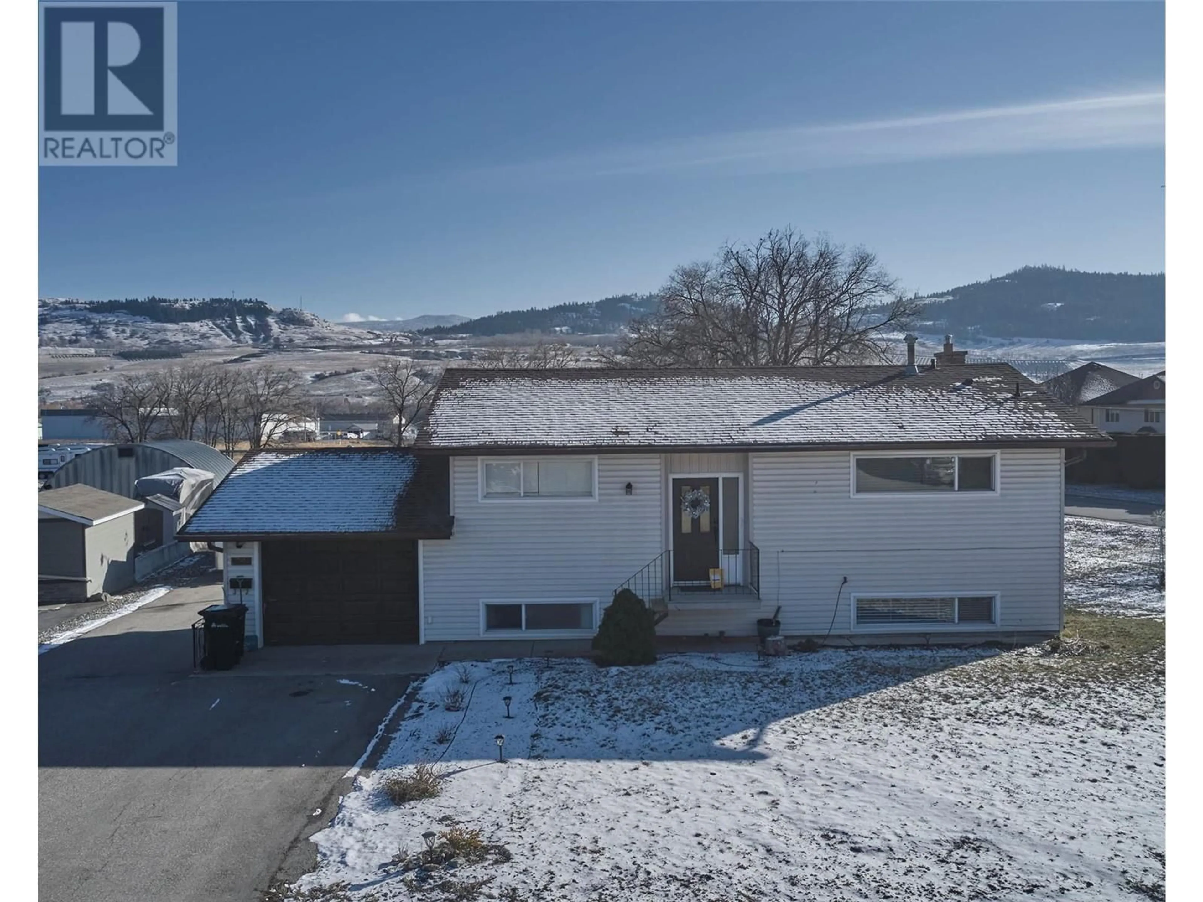 A pic from outside/outdoor area/front of a property/back of a property/a pic from drone, mountain view for 6576 Scott Road, Vernon British Columbia V1H1N7