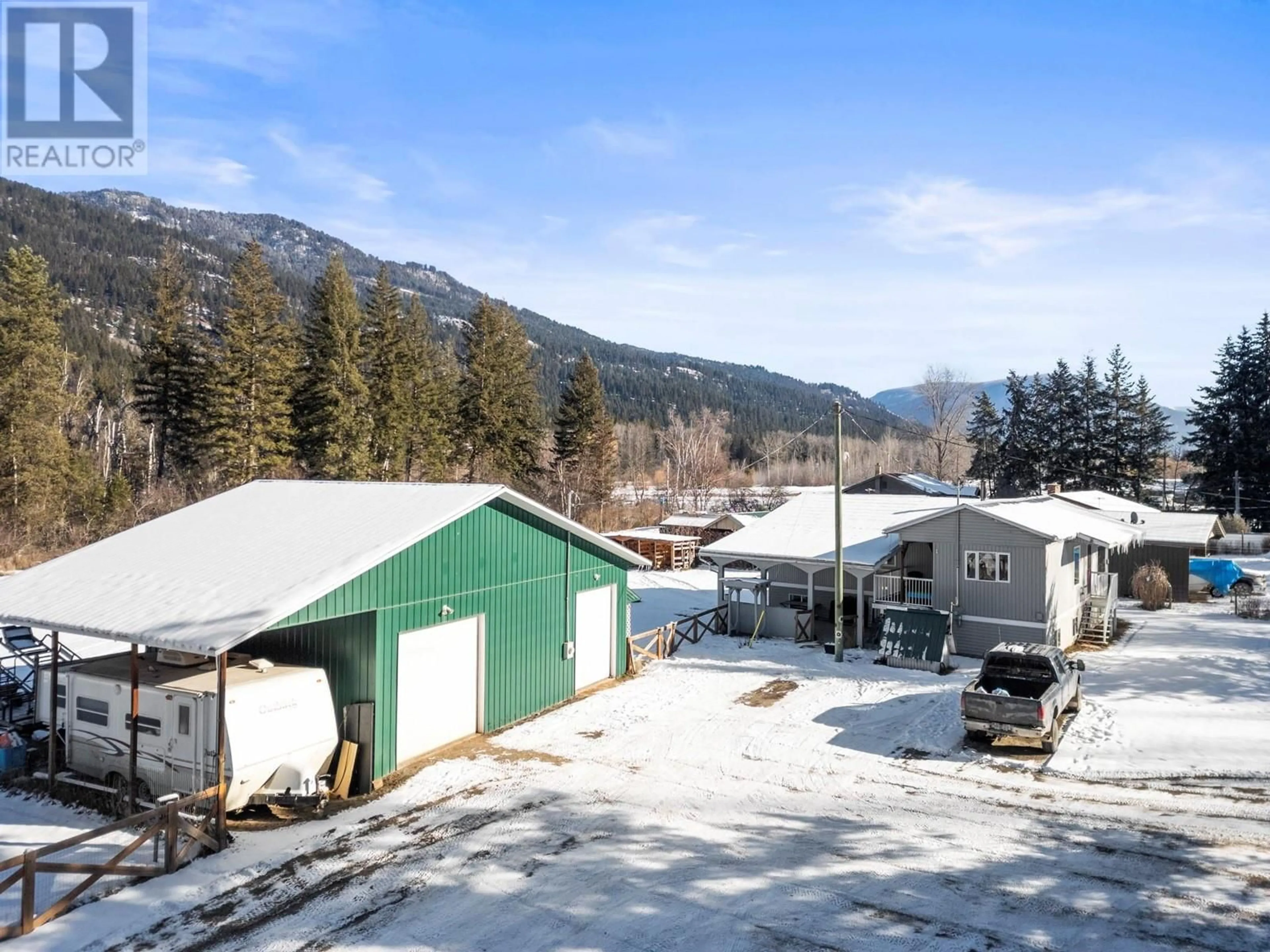 A pic from outside/outdoor area/front of a property/back of a property/a pic from drone, mountain view for 1371 6 Highway, Cherryville British Columbia V0E2G1