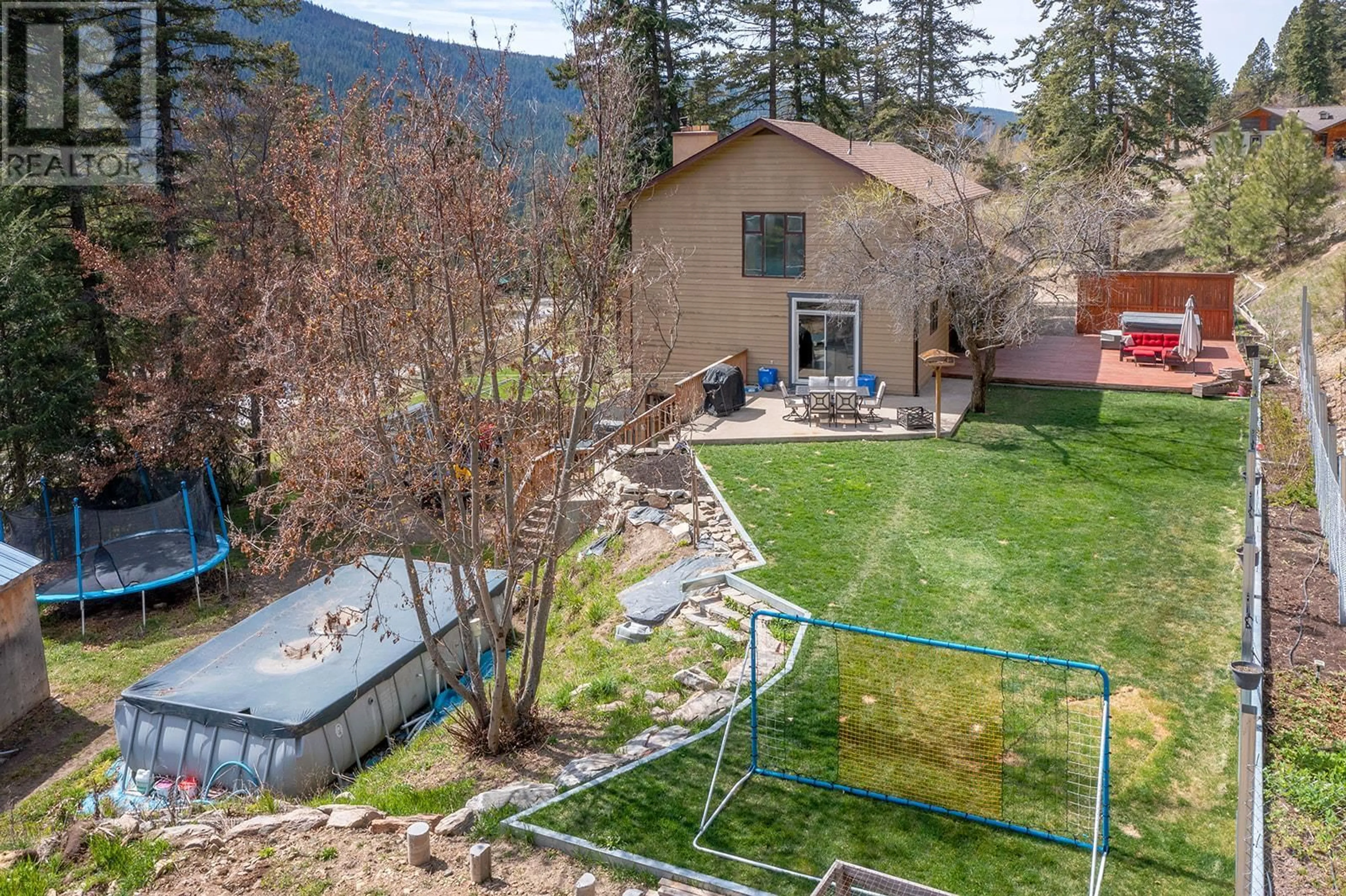 A pic from outside/outdoor area/front of a property/back of a property/a pic from drone, mountain view for 6750 HIGHWAY 33 OTHER EAST, Kelowna British Columbia V1P1H9