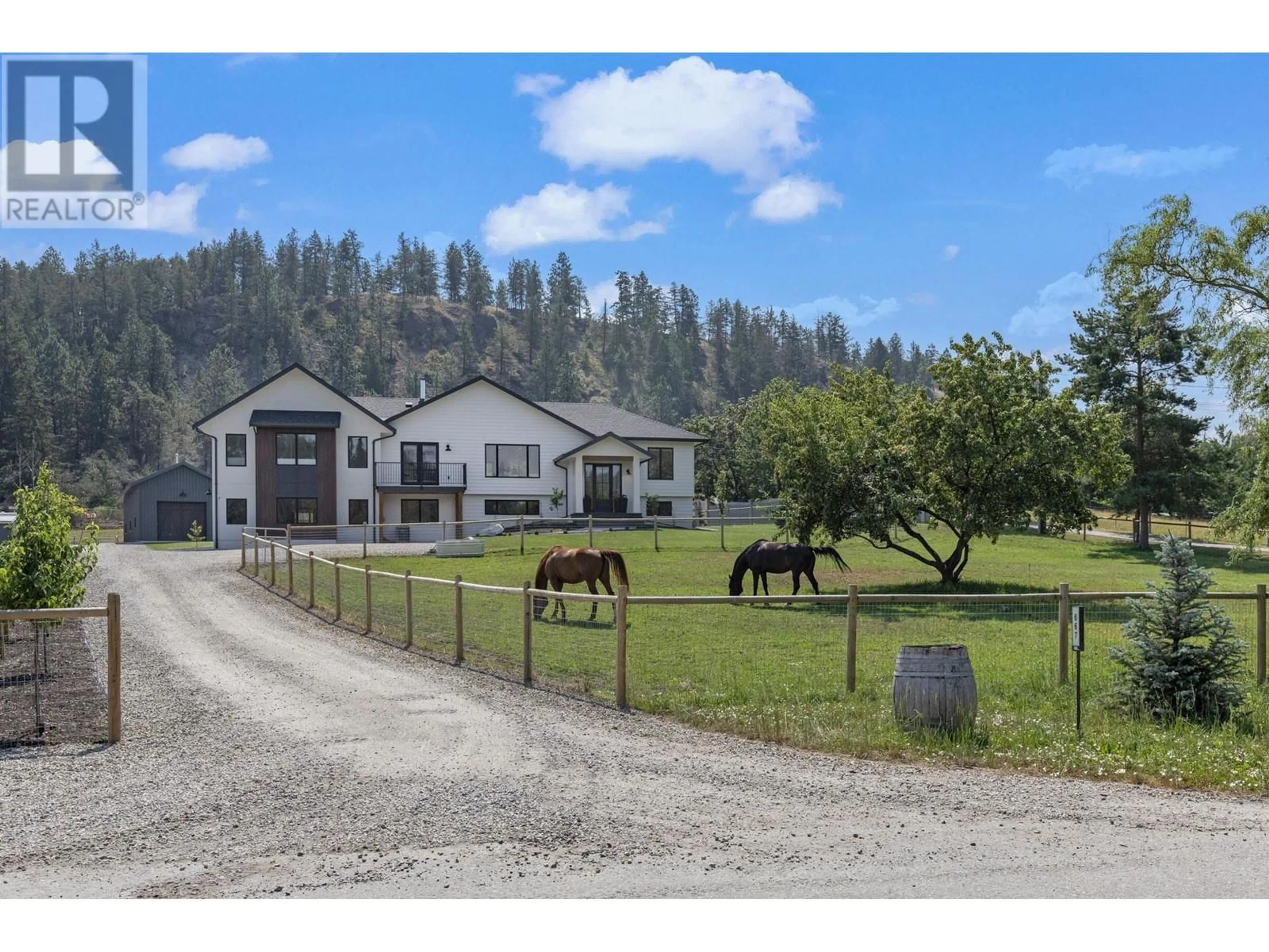 A pic from outside/outdoor area/front of a property/back of a property/a pic from drone, mountain view for 667 Curtis Road, Kelowna British Columbia V1V2C9