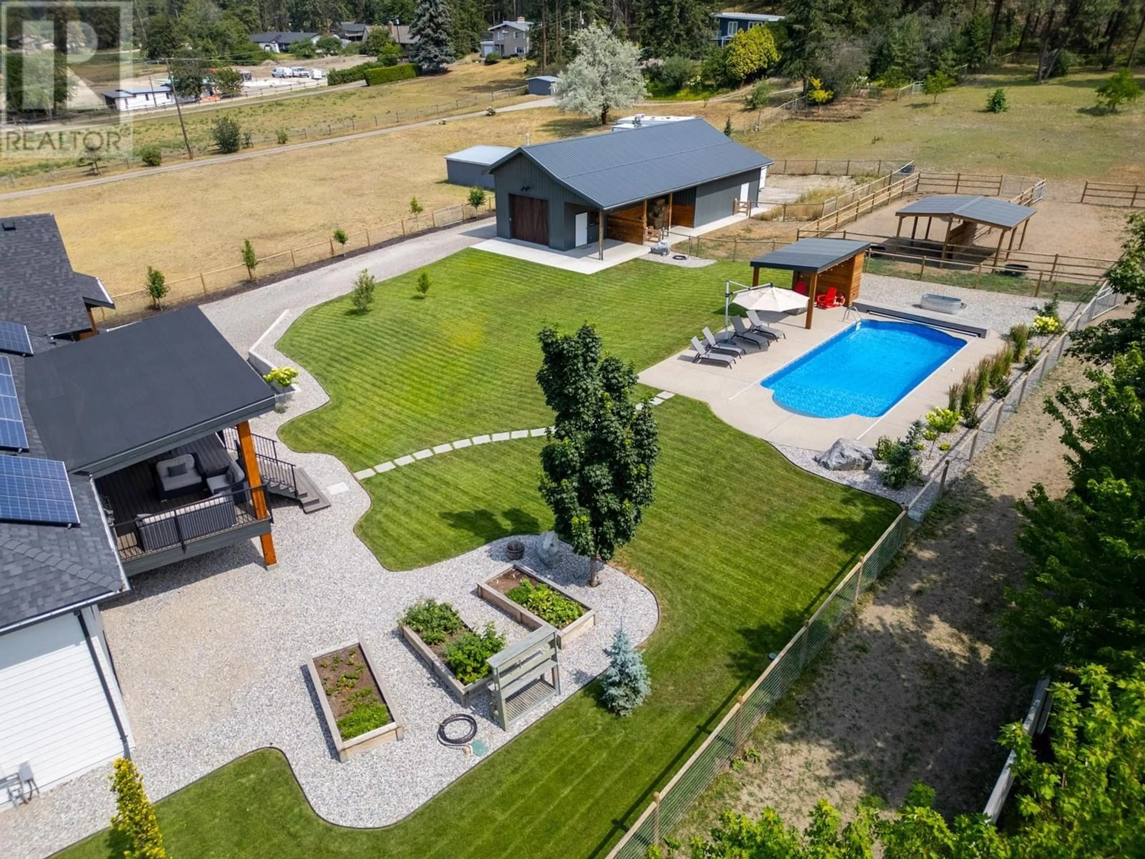 A pic from outside/outdoor area/front of a property/back of a property/a pic from drone, water/lake/river/ocean view for 667 Curtis Road, Kelowna British Columbia V1V2C9