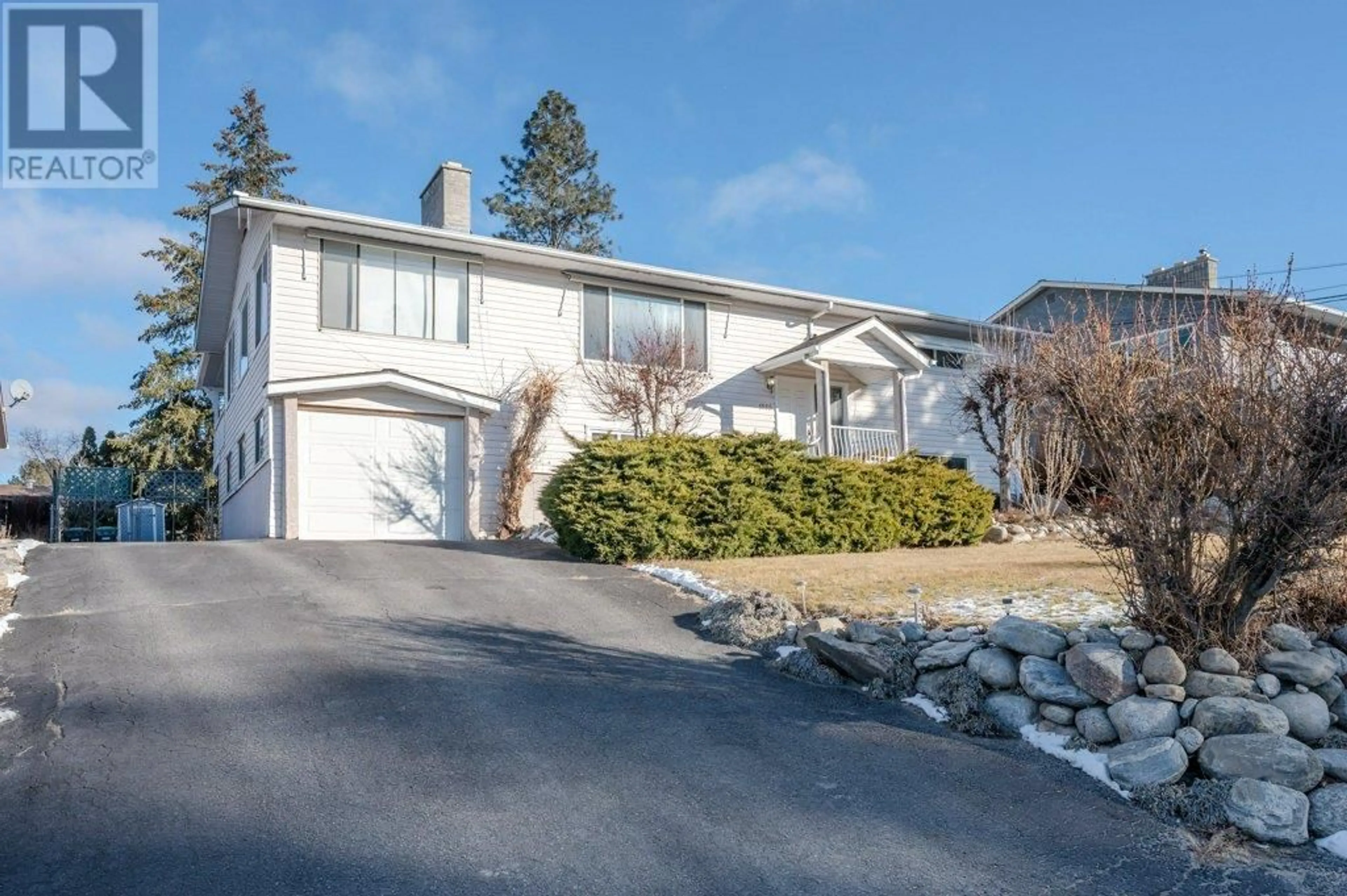 Home with vinyl exterior material, street for 1555 CARMI AVENUE, Penticton British Columbia V2A8V5