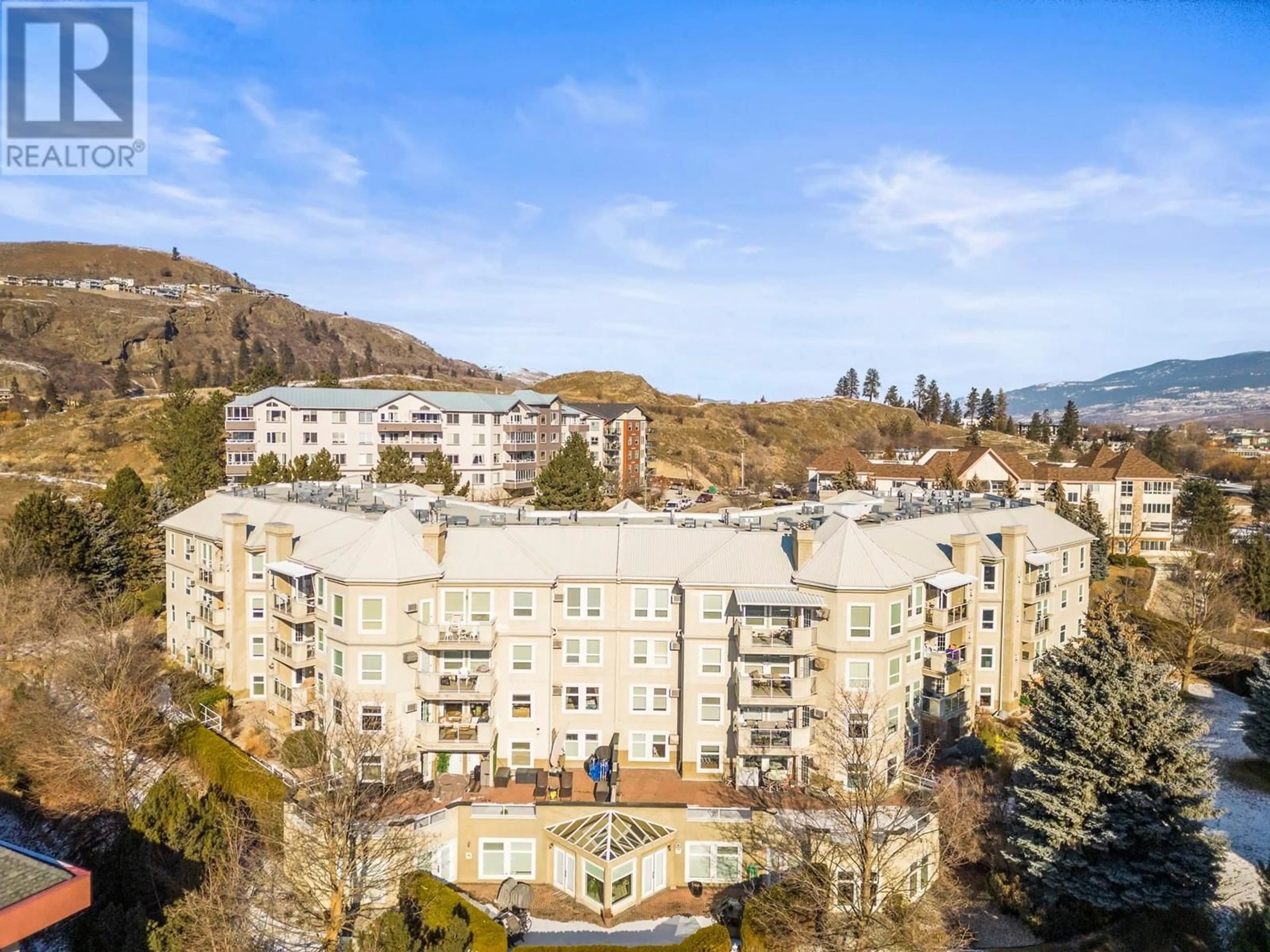 A pic from outside/outdoor area/front of a property/back of a property/a pic from drone, mountain view for 3300 Centennial Drive Unit# 104, Vernon British Columbia V1T9M5