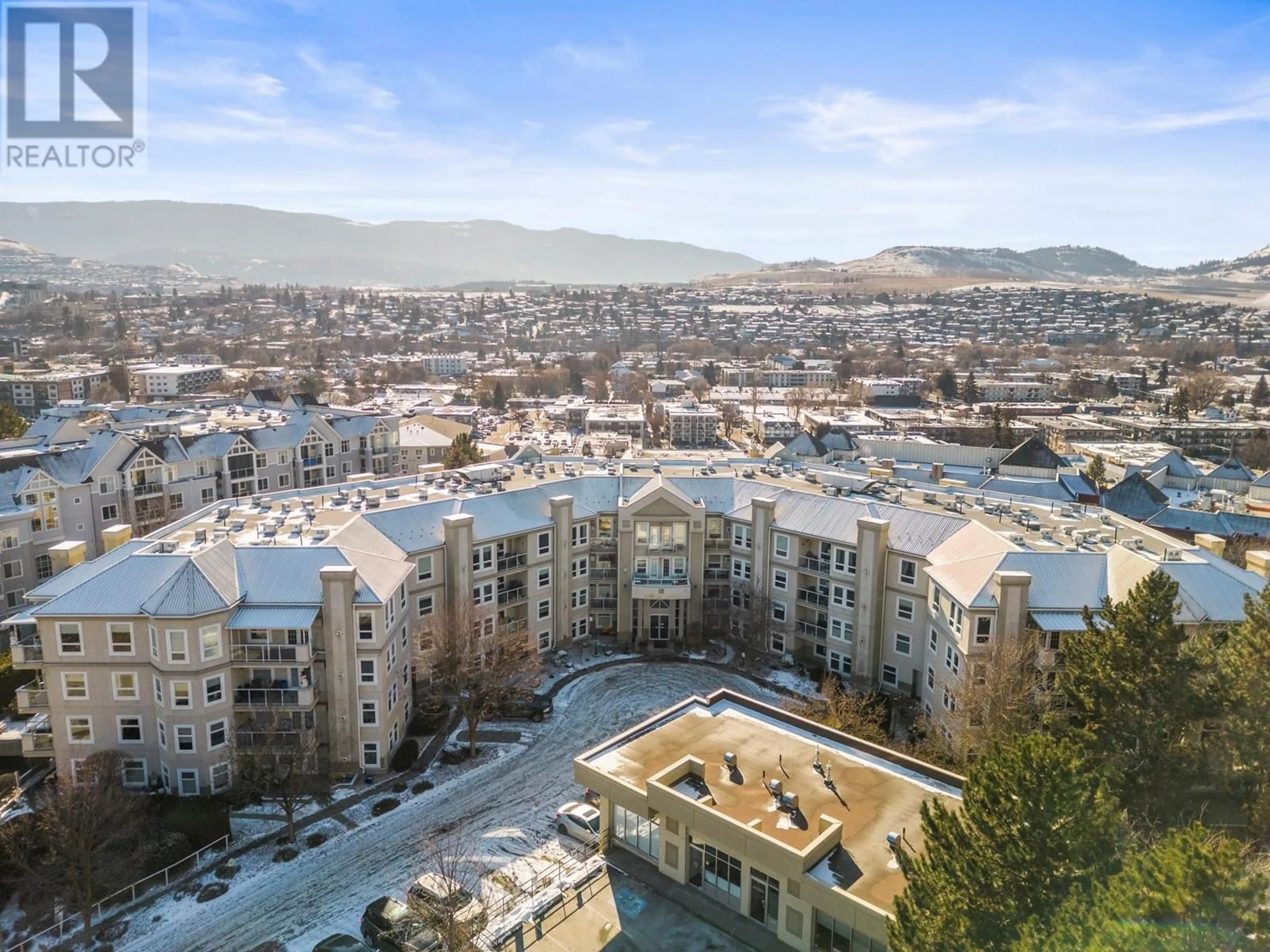 A pic from outside/outdoor area/front of a property/back of a property/a pic from drone, city buildings view from balcony for 3300 Centennial Drive Unit# 104, Vernon British Columbia V1T9M5