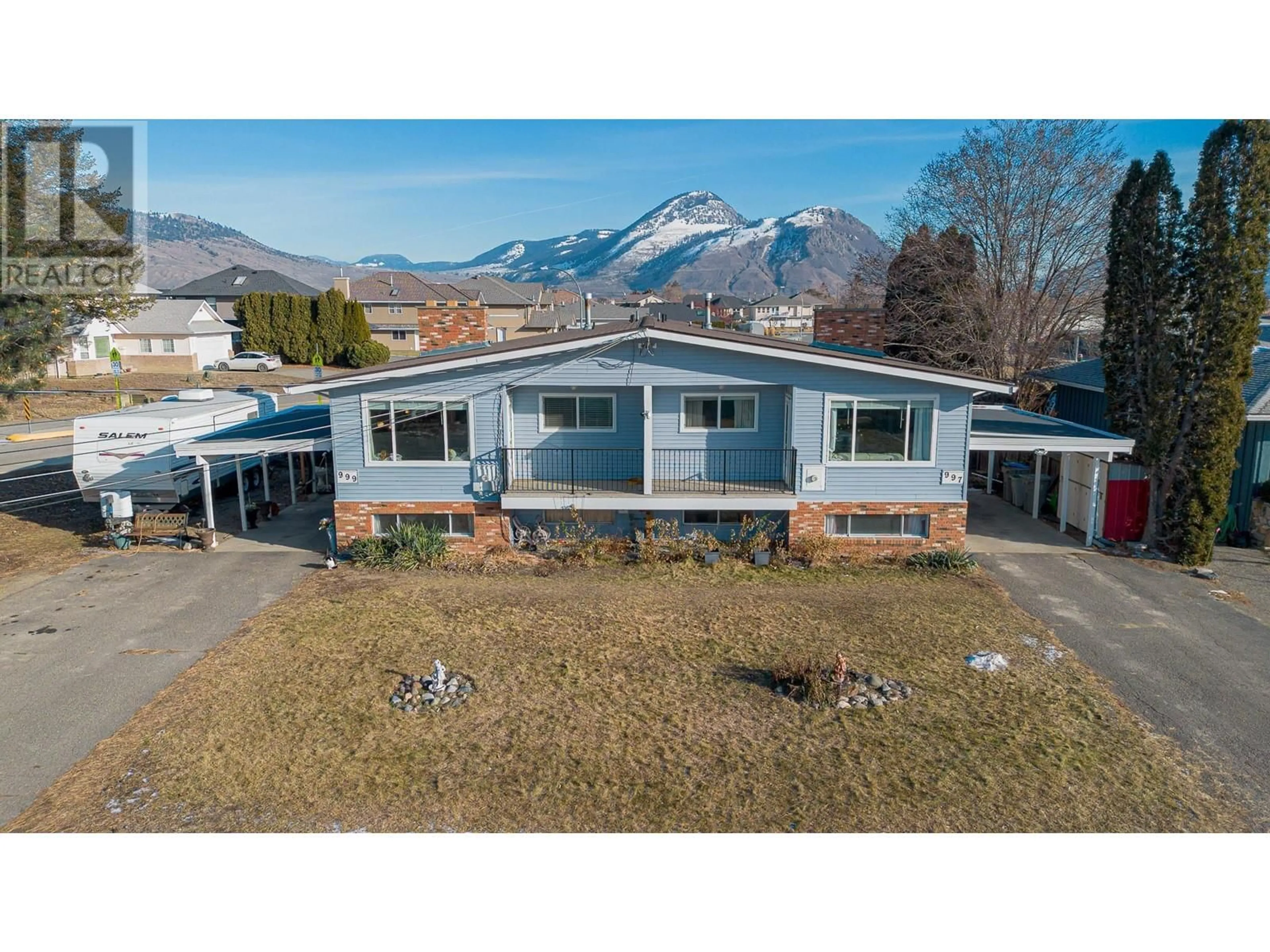 A pic from outside/outdoor area/front of a property/back of a property/a pic from drone, mountain view for 997/999 OLLEK Street, Kamloops British Columbia V2B5A8