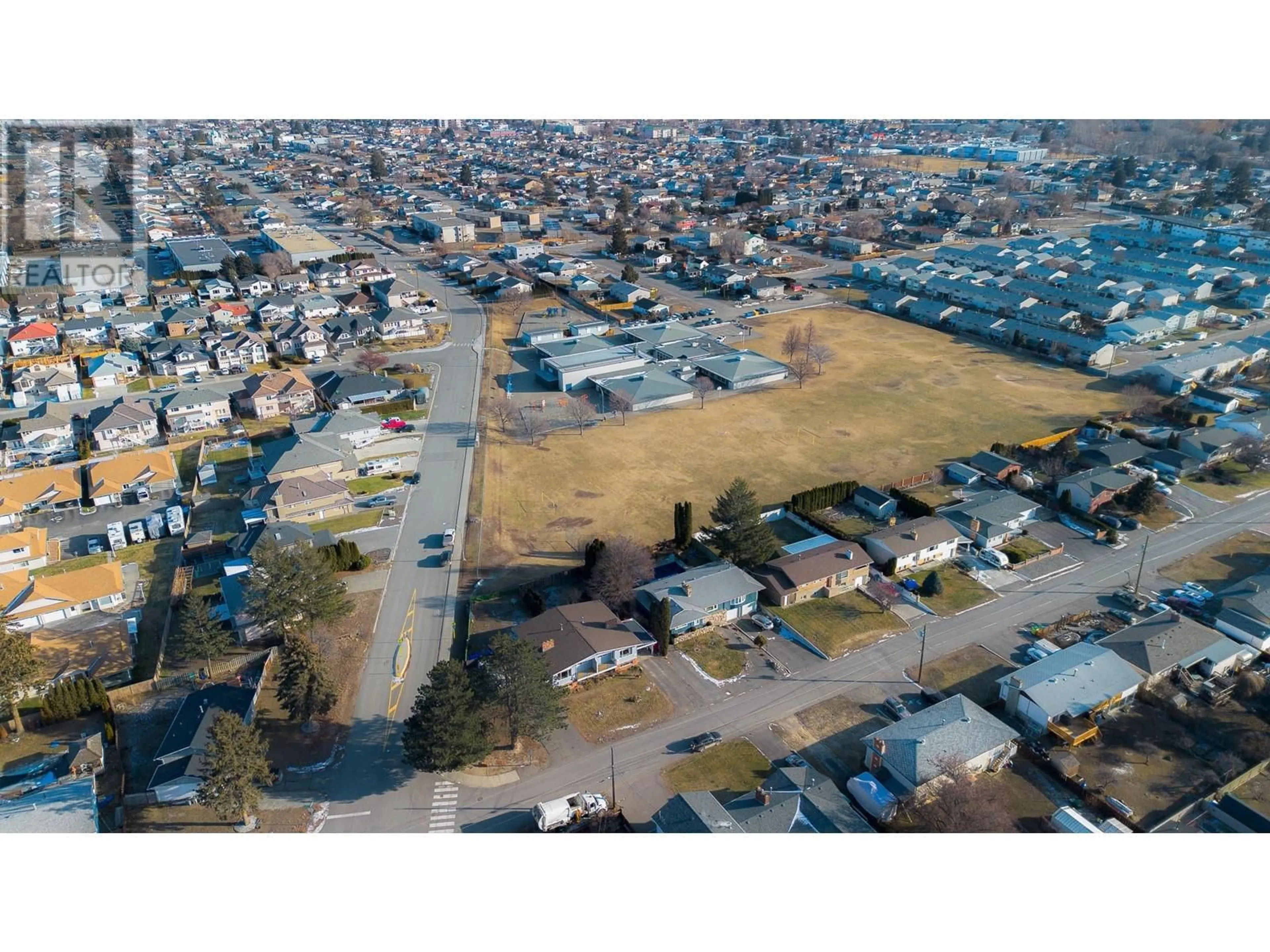 A pic from outside/outdoor area/front of a property/back of a property/a pic from drone, street for 997/999 OLLEK Street, Kamloops British Columbia V2B5A8