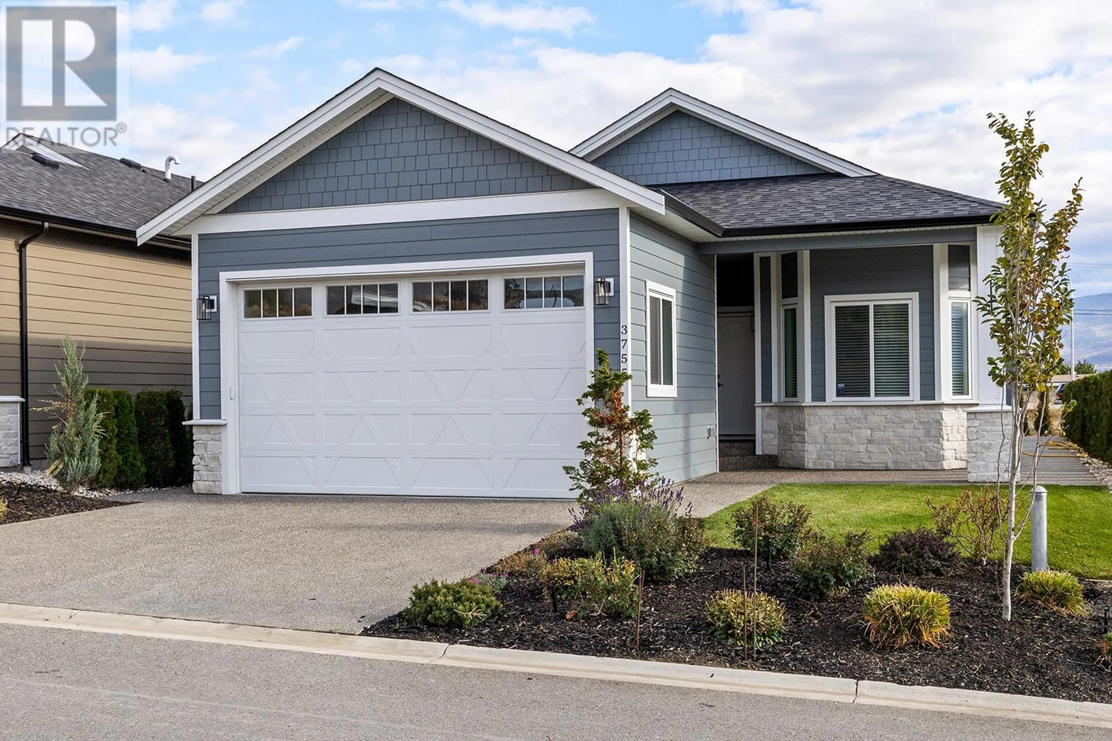 Home with vinyl exterior material, street for 3755 St. James Drive, West Kelowna British Columbia V4T3A5