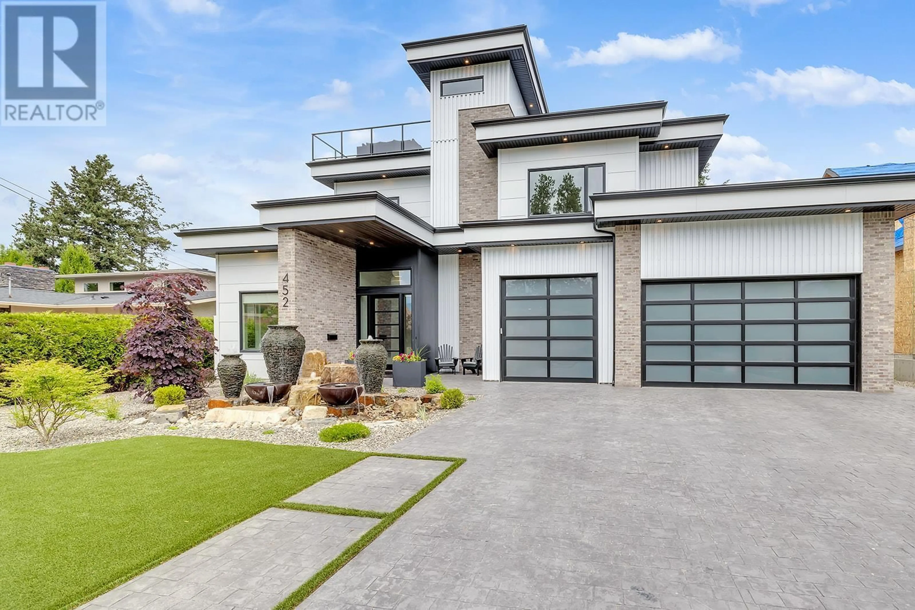 Home with brick exterior material, street for 452 KNOWLES ROAD, Kelowna British Columbia V1W1H3