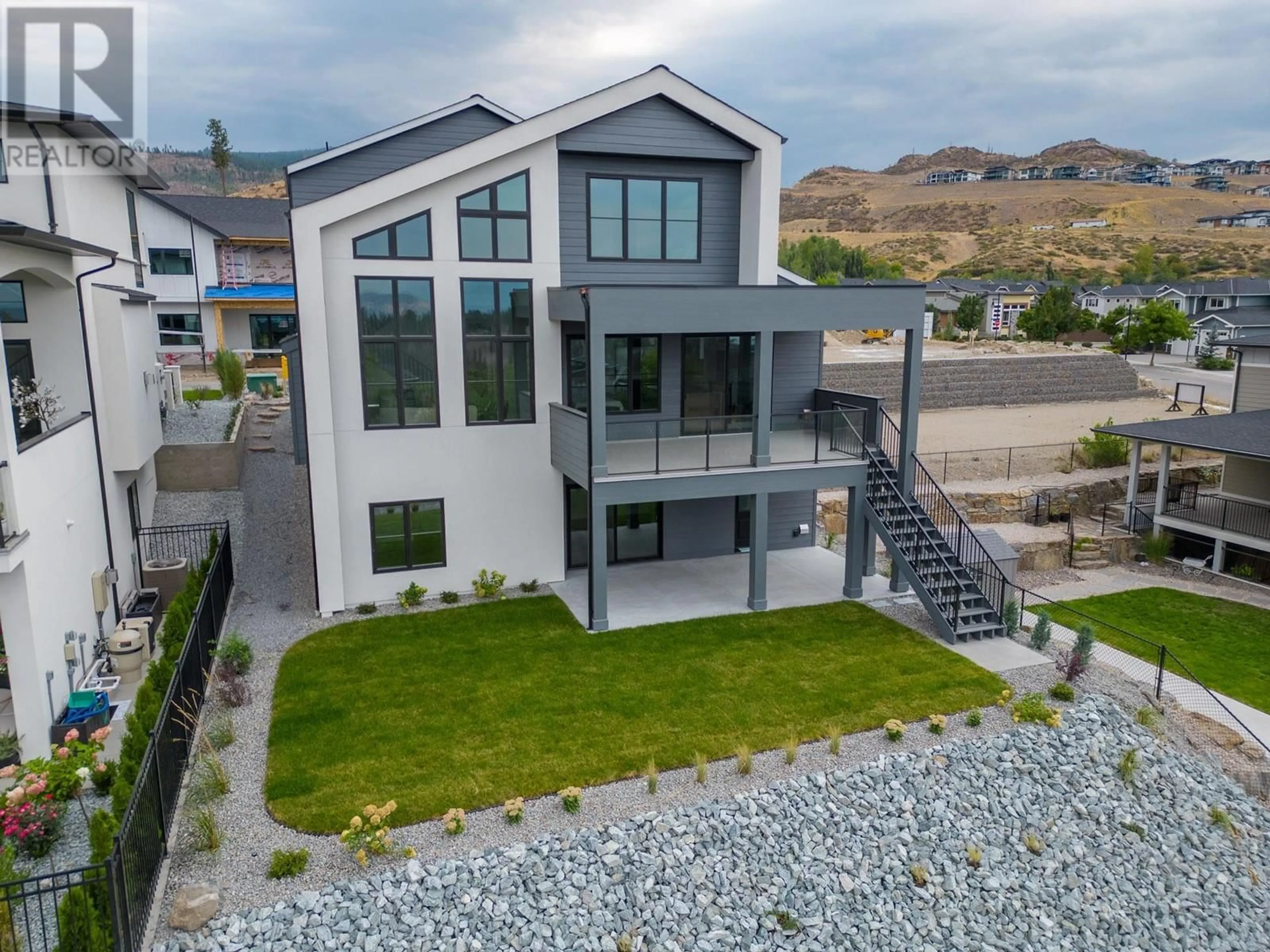 A pic from outside/outdoor area/front of a property/back of a property/a pic from drone, mountain view for 4964 BUCKTAIL LANE, Kelowna British Columbia V1W5L3