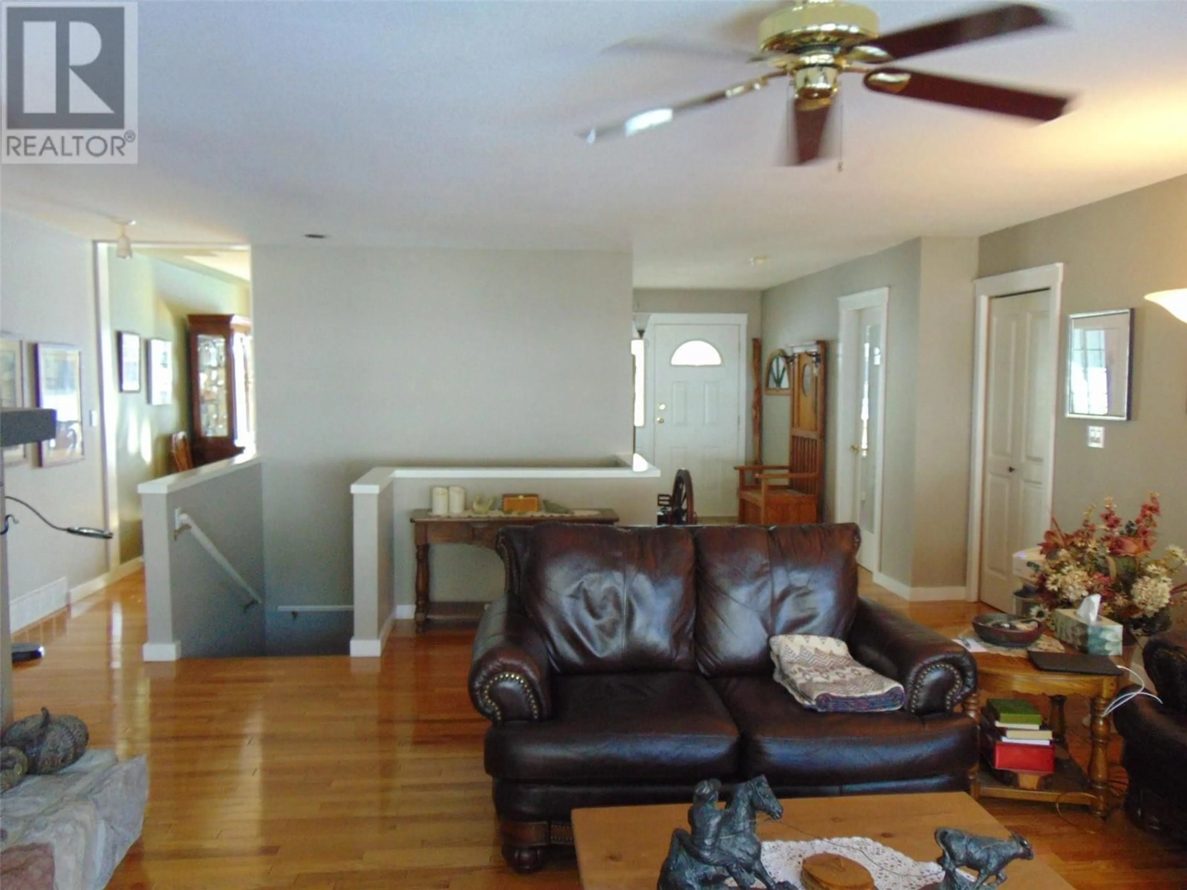 Living room with furniture, wood/laminate floor for 2593 Golf View Crescent, Blind Bay British Columbia V0E1H1