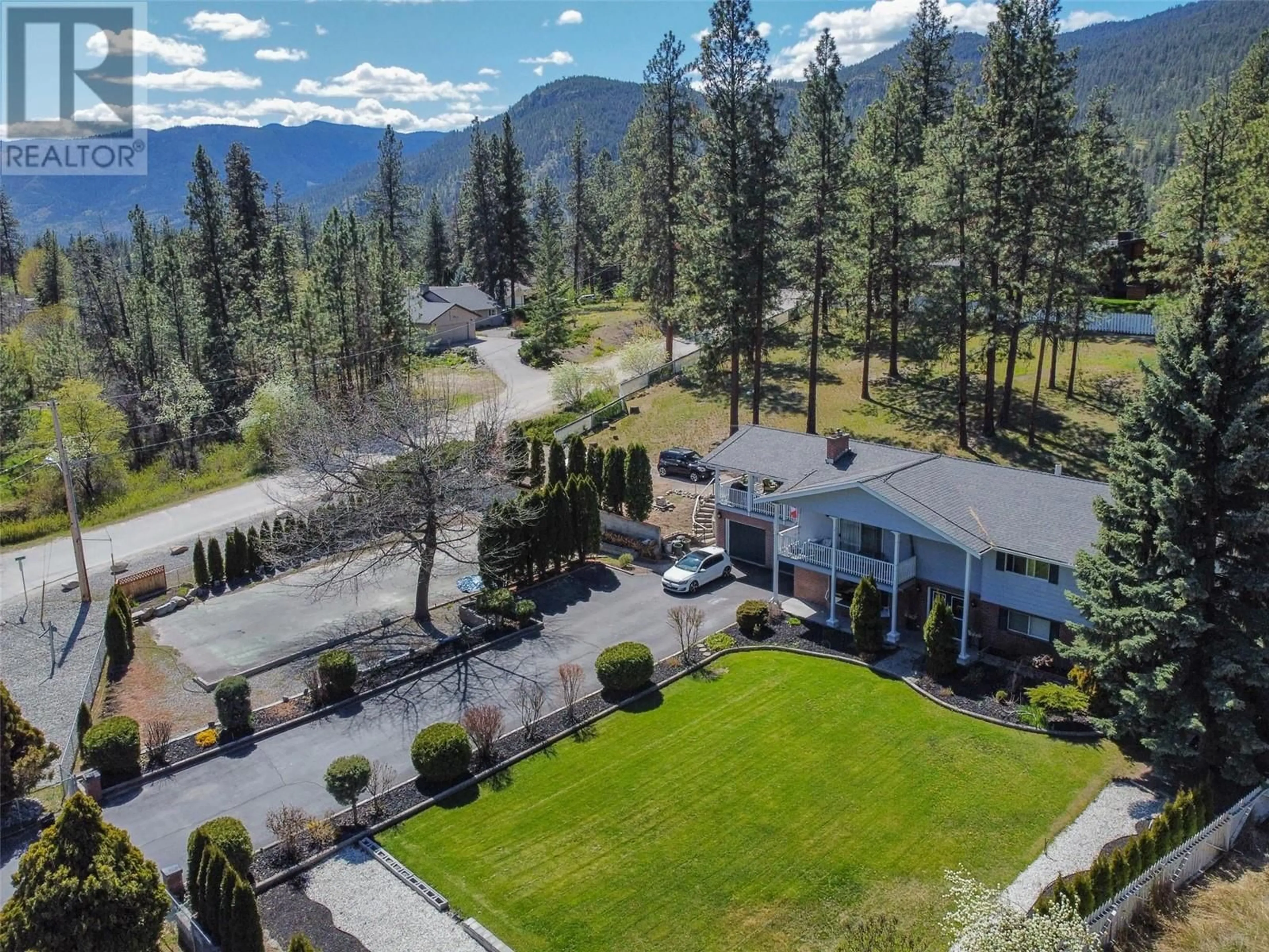 A pic from outside/outdoor area/front of a property/back of a property/a pic from drone, mountain view for 3808 Forsyth Drive, Penticton British Columbia V2A8Z2