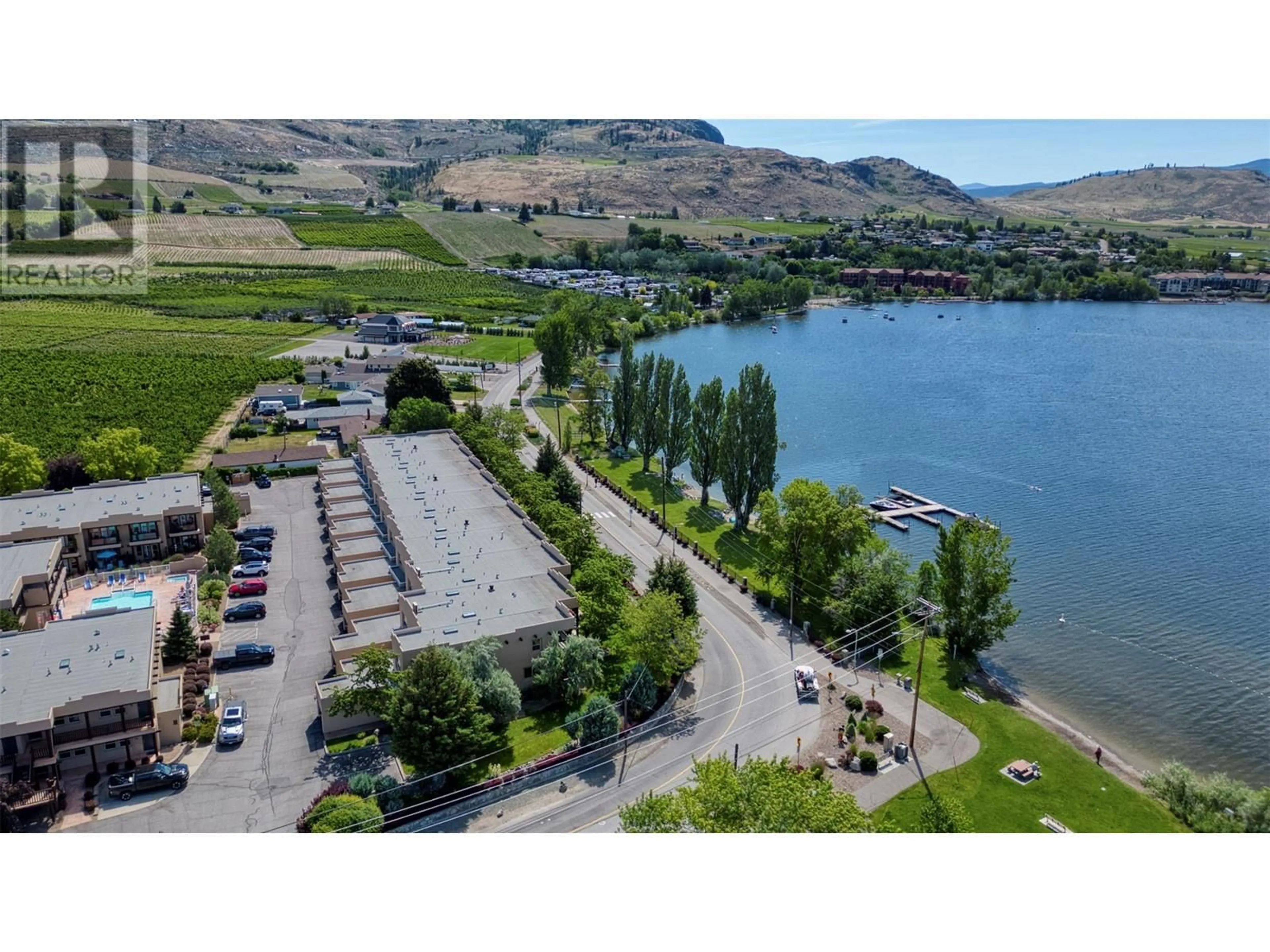 A pic from outside/outdoor area/front of a property/back of a property/a pic from drone, water/lake/river/ocean view for 102 - 5401 LAKESHORE DRIVE, Osoyoos British Columbia V0H1V3