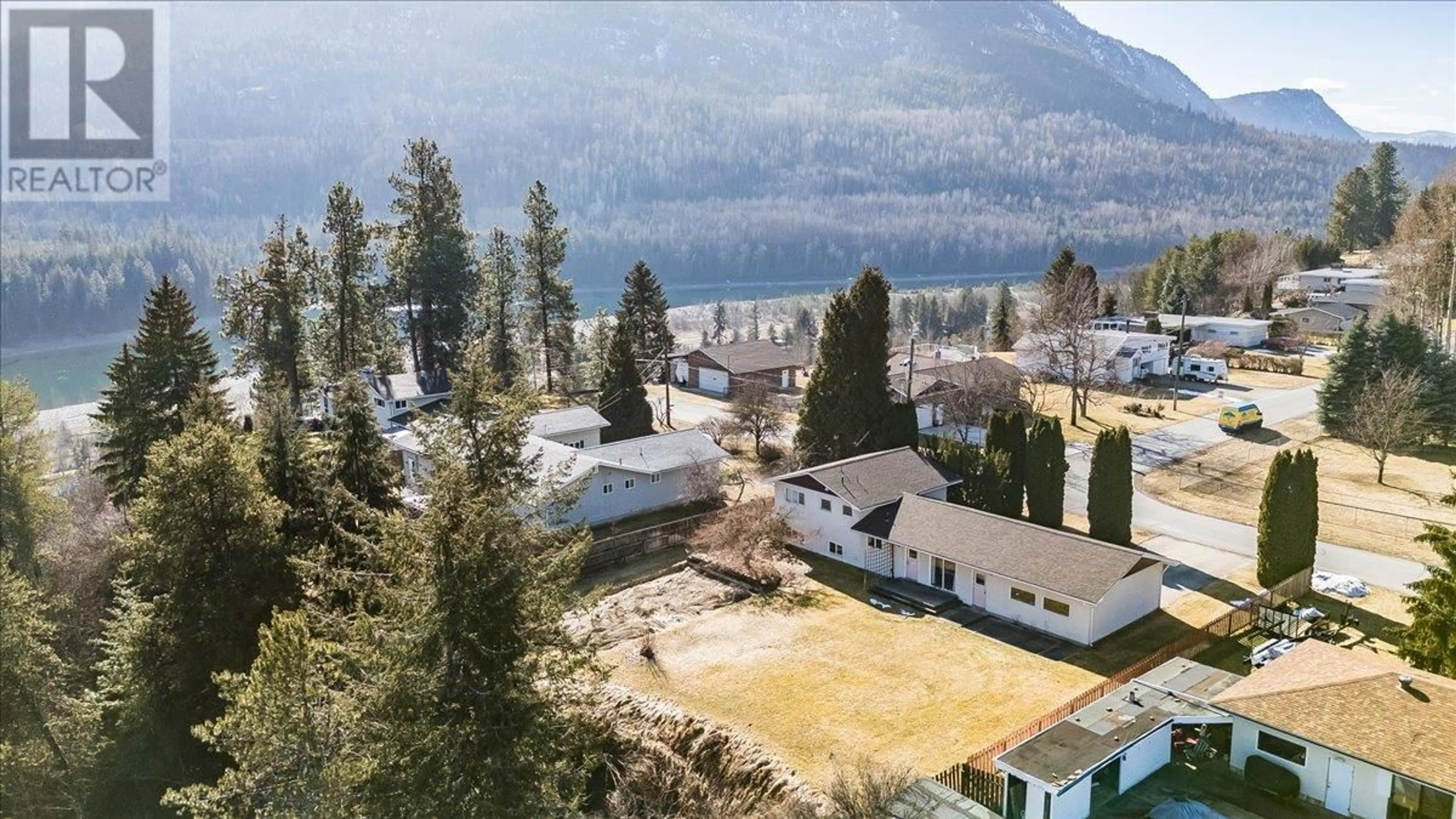 A pic from outside/outdoor area/front of a property/back of a property/a pic from drone, mountain view for 1309 6TH STREET, Genelle British Columbia V0G1G0