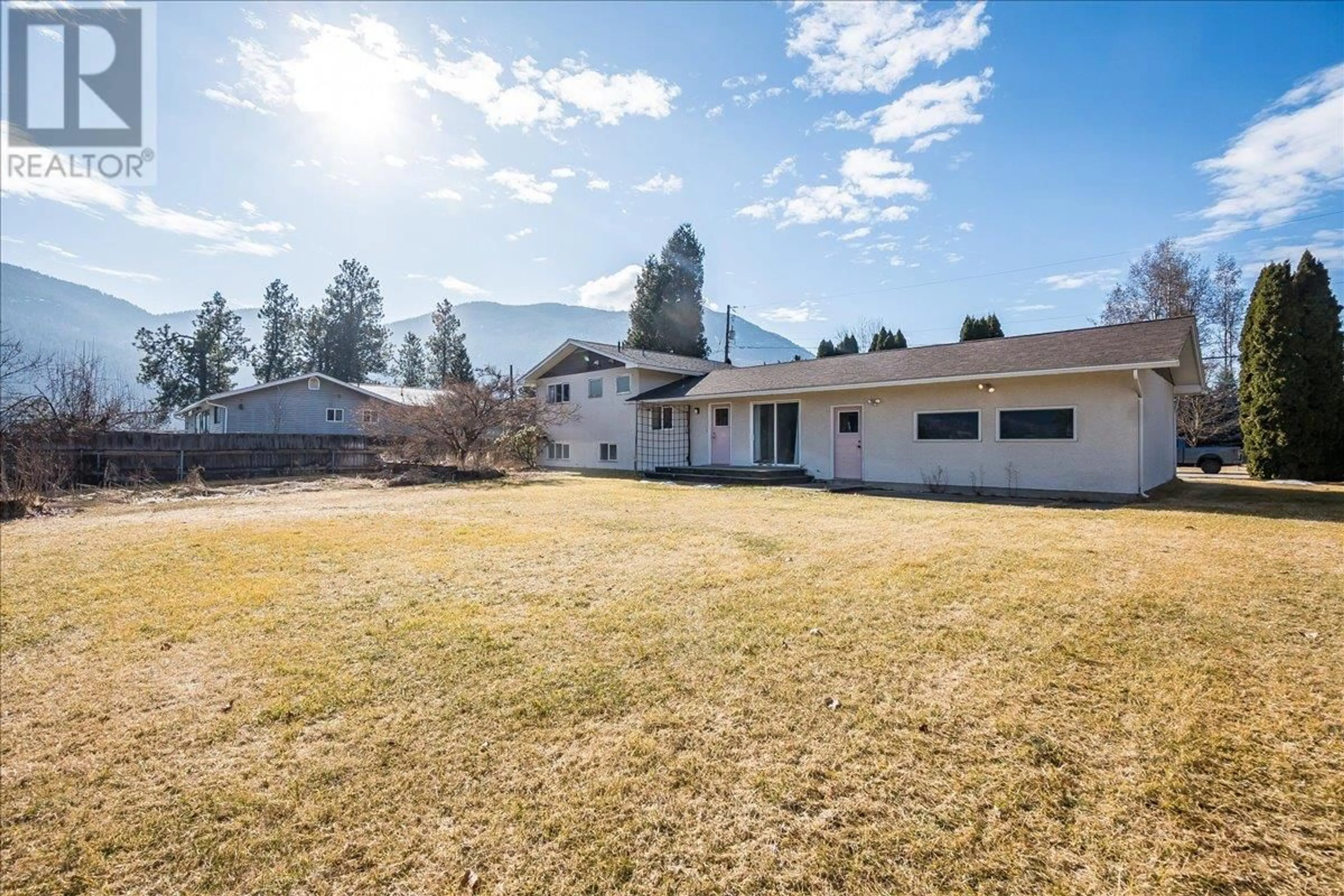 A pic from outside/outdoor area/front of a property/back of a property/a pic from drone, mountain view for 1309 6TH STREET, Genelle British Columbia V0G1G0