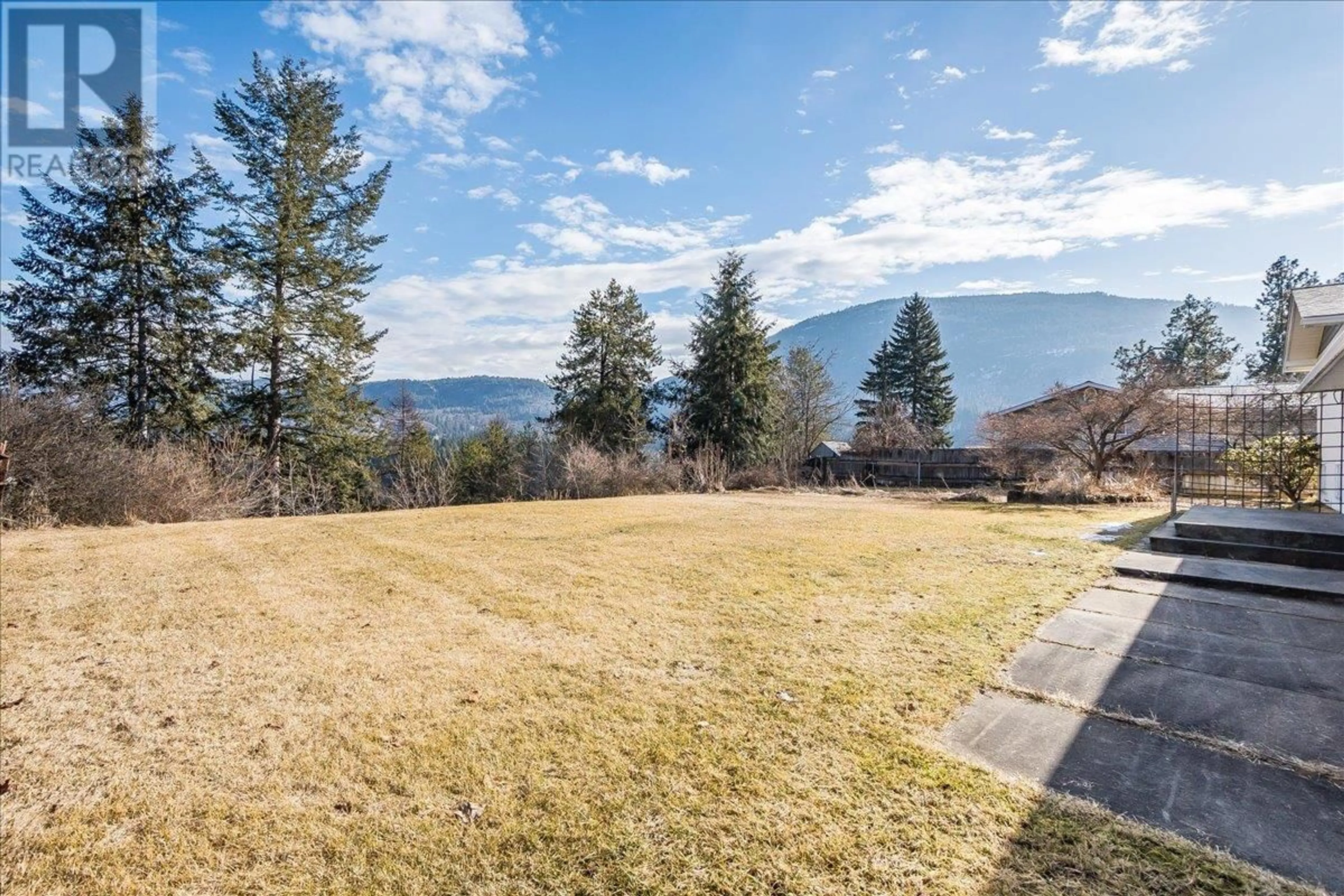 A pic from outside/outdoor area/front of a property/back of a property/a pic from drone, water/lake/river/ocean view for 1309 6TH STREET, Genelle British Columbia V0G1G0