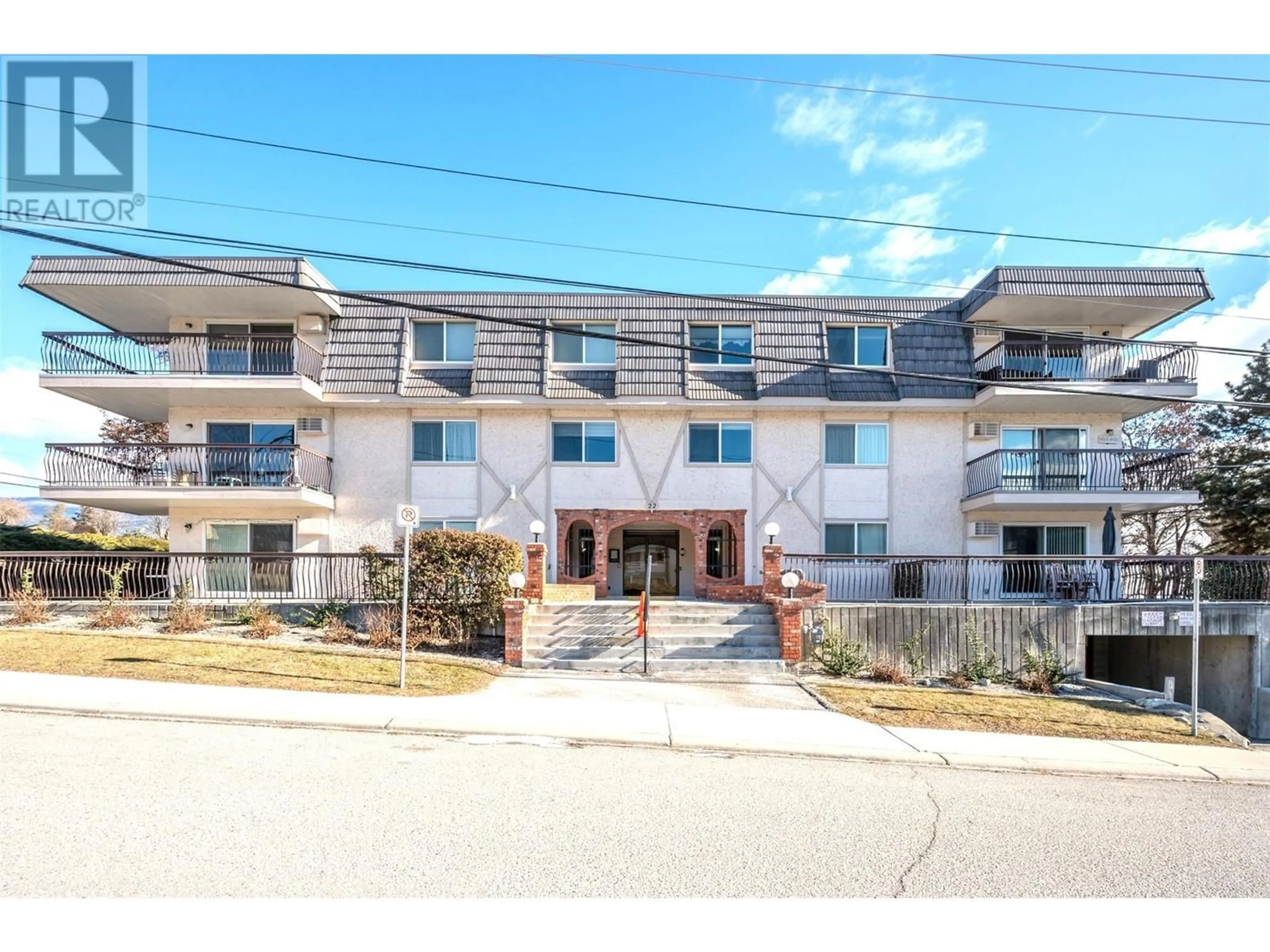 A pic from outside/outdoor area/front of a property/back of a property/a pic from drone, street for 22 Abbott Street Unit# 201, Penticton British Columbia V2A4J2