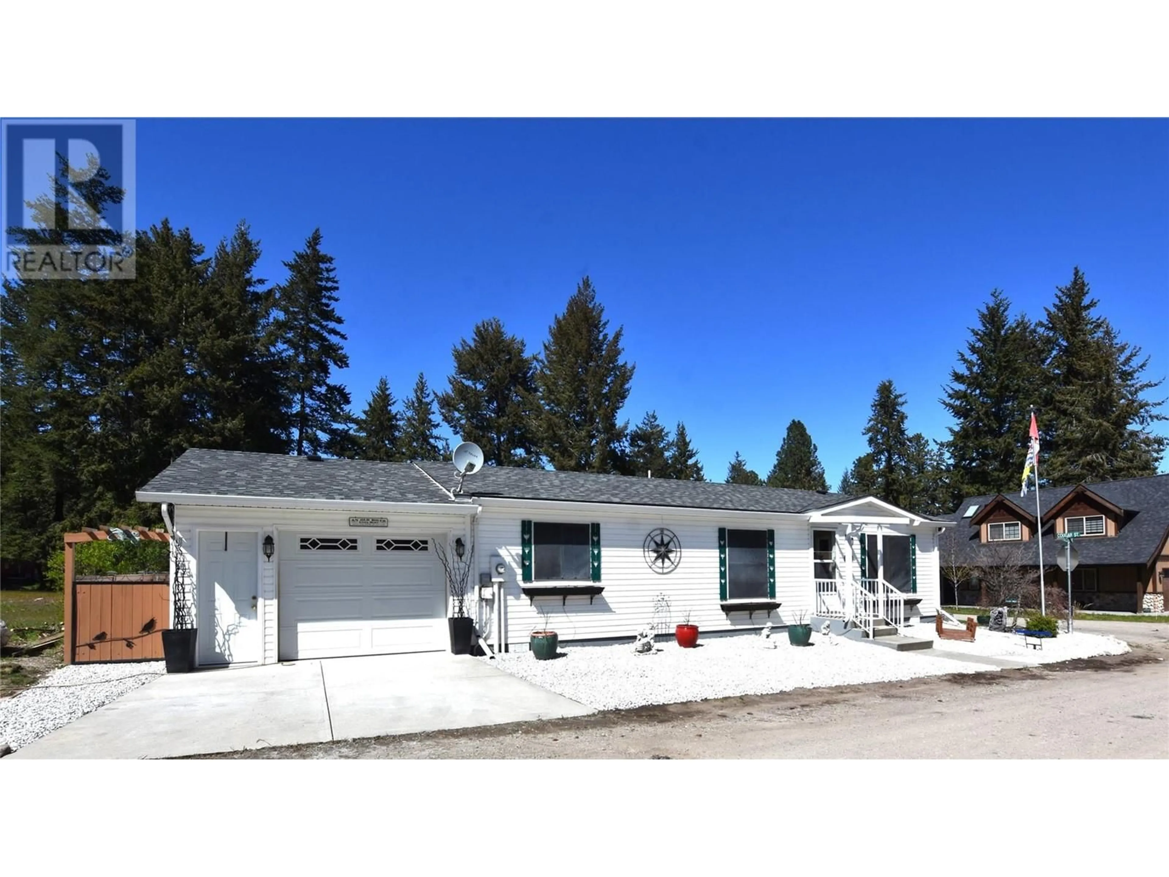 Home with vinyl exterior material, street for 223 COUGAR STREET, Vernon British Columbia V1H2A1