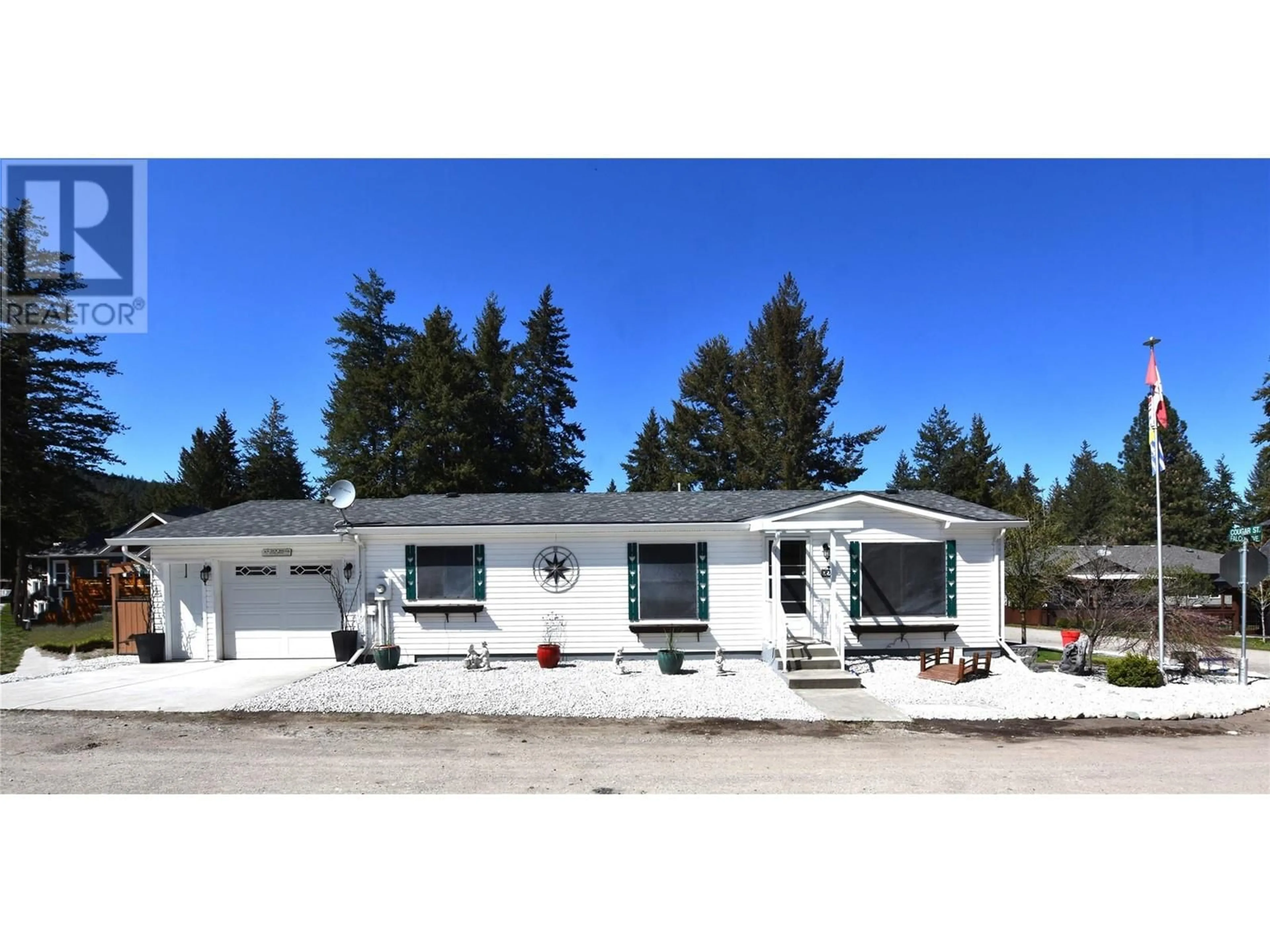 Home with vinyl exterior material, street for 223 COUGAR STREET, Vernon British Columbia V1H2A1