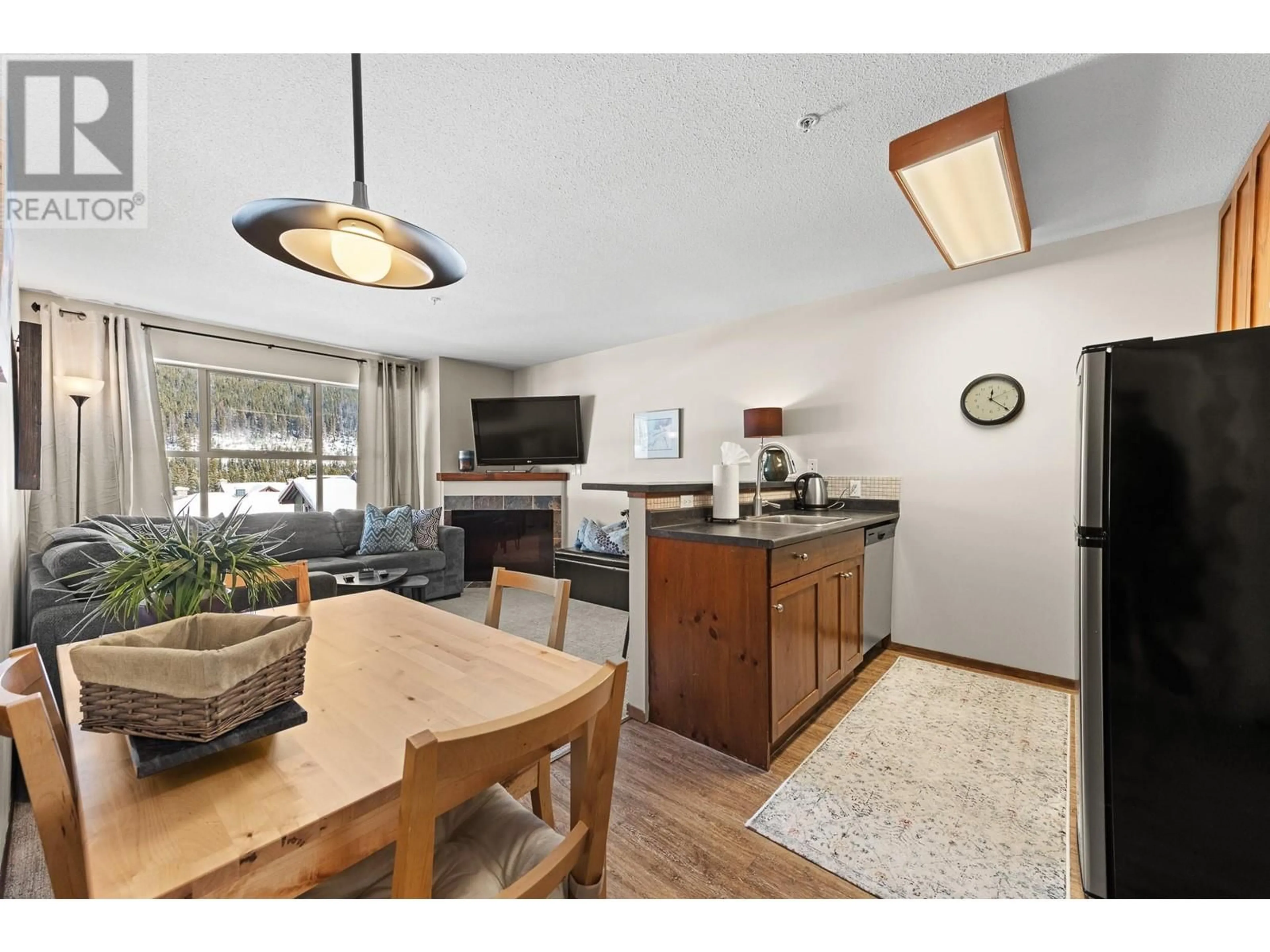 Open concept kitchen, wood/laminate floor for 300 Strayhorse Road Unit# 309/310, Penticton British Columbia V2A0E2