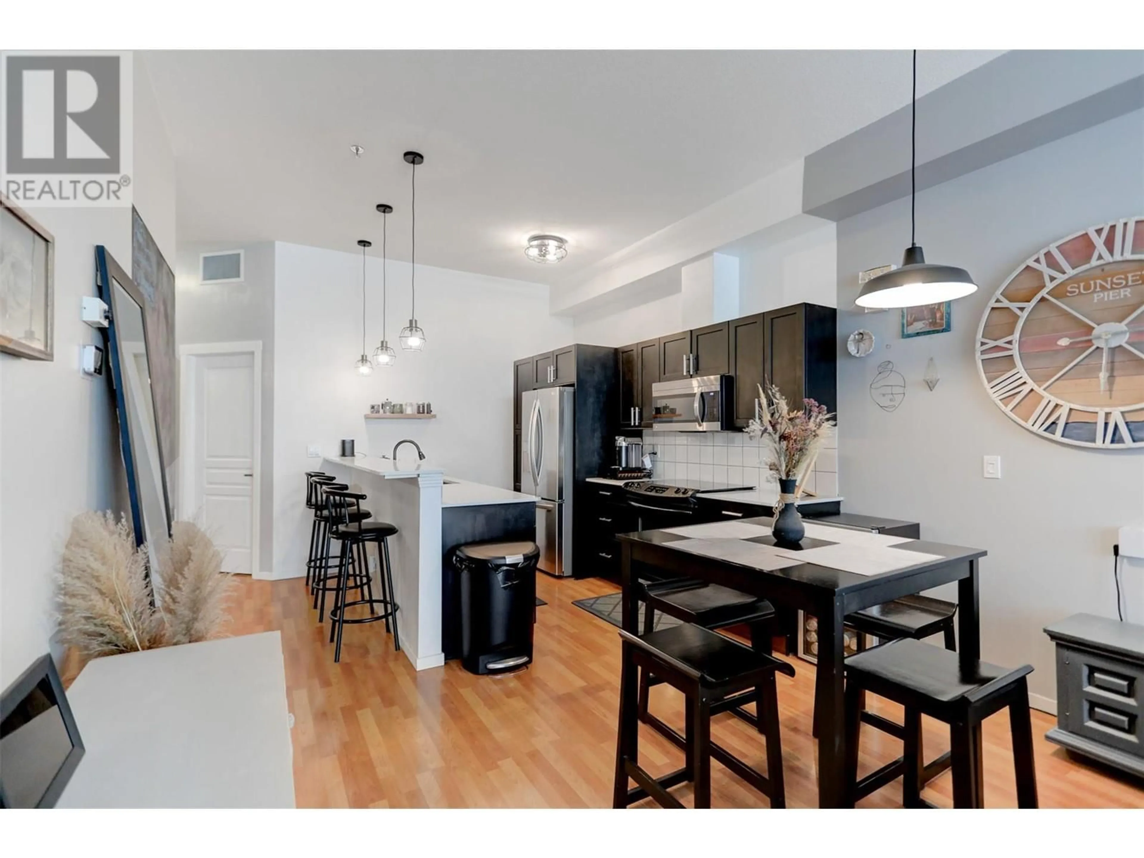 Open concept kitchen, wood/laminate floor for 1331 Ellis Street Unit# 108, Kelowna British Columbia V1Y1Z9