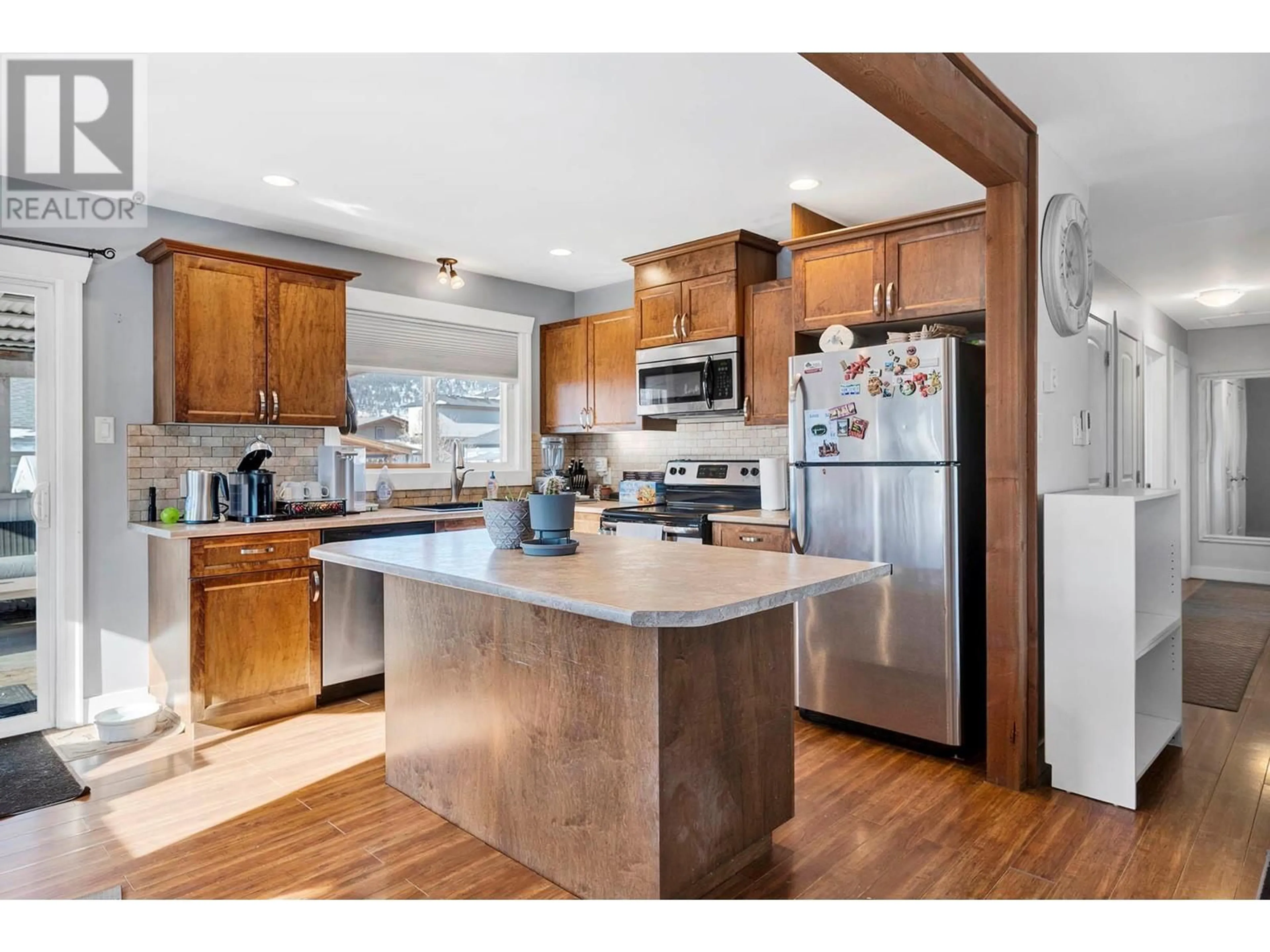 Open concept kitchen, wood/laminate floor for 1601 BLAIR STREET, Merritt British Columbia V1K1B8