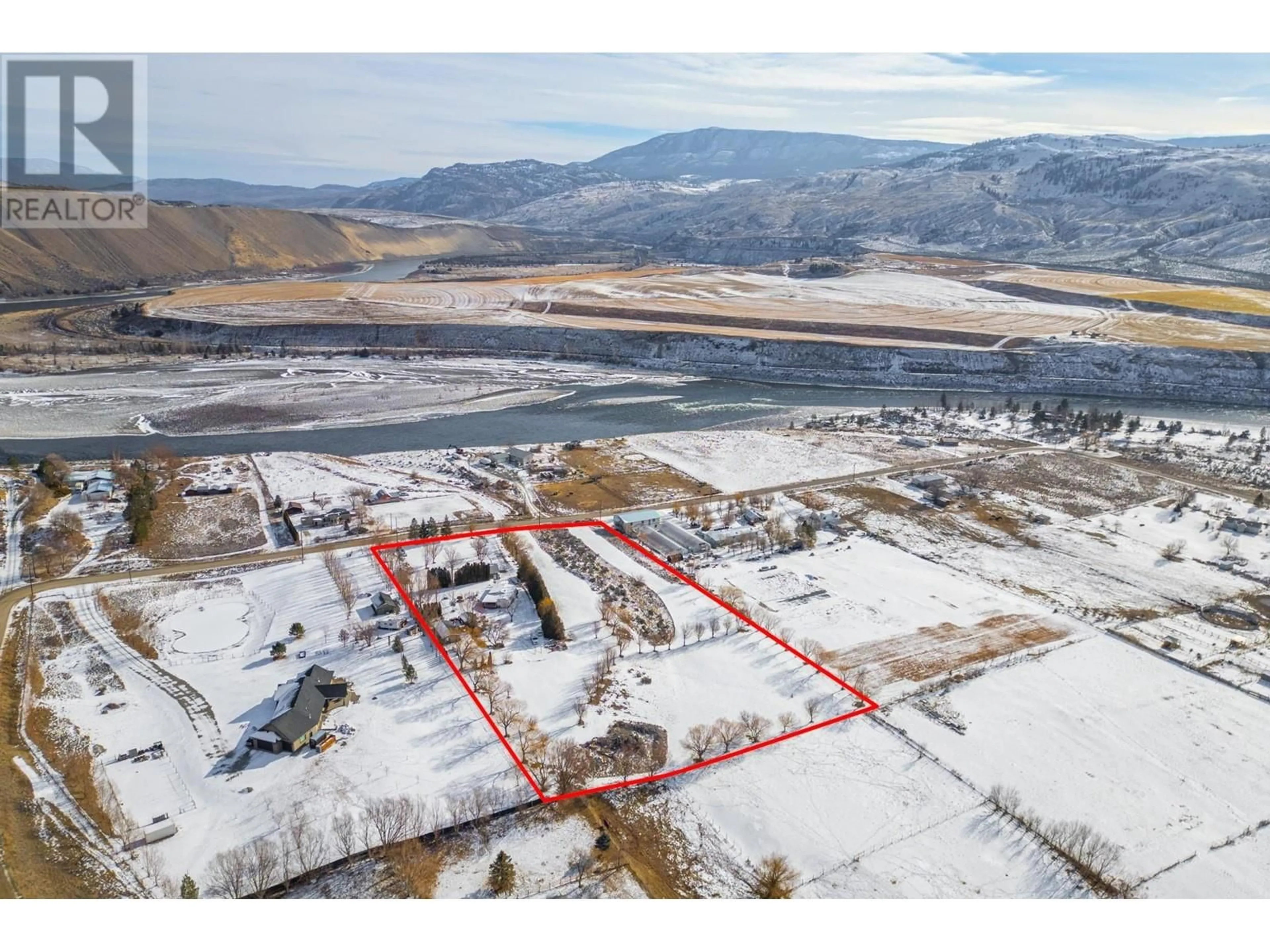 A pic from outside/outdoor area/front of a property/back of a property/a pic from drone, mountain view for 6969 Thompson River Drive, Kamloops British Columbia V0K2P0