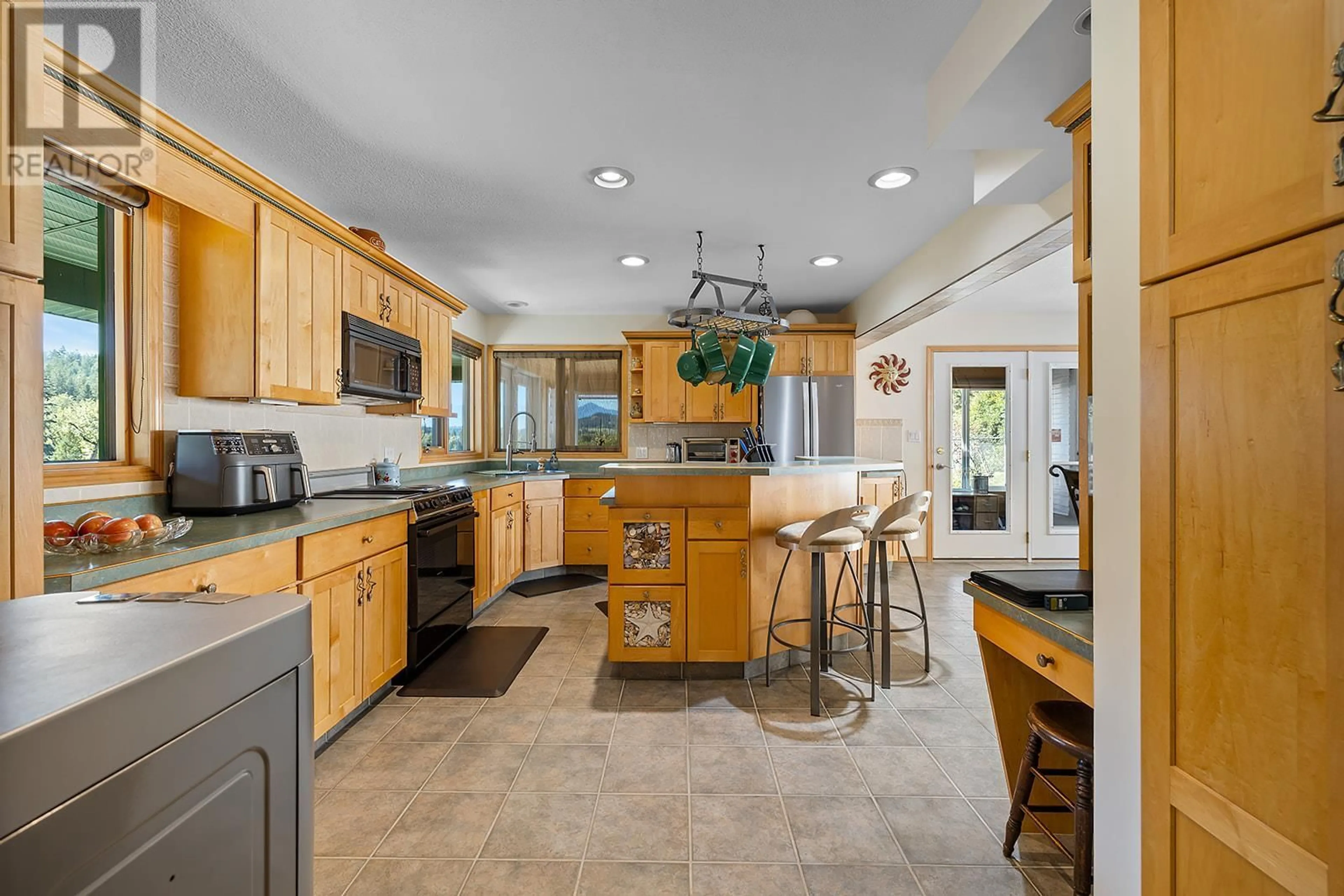 Open concept kitchen, ceramic/tile floor for 3823 GOAT CANYON ROAD, Creston British Columbia V0B1G9