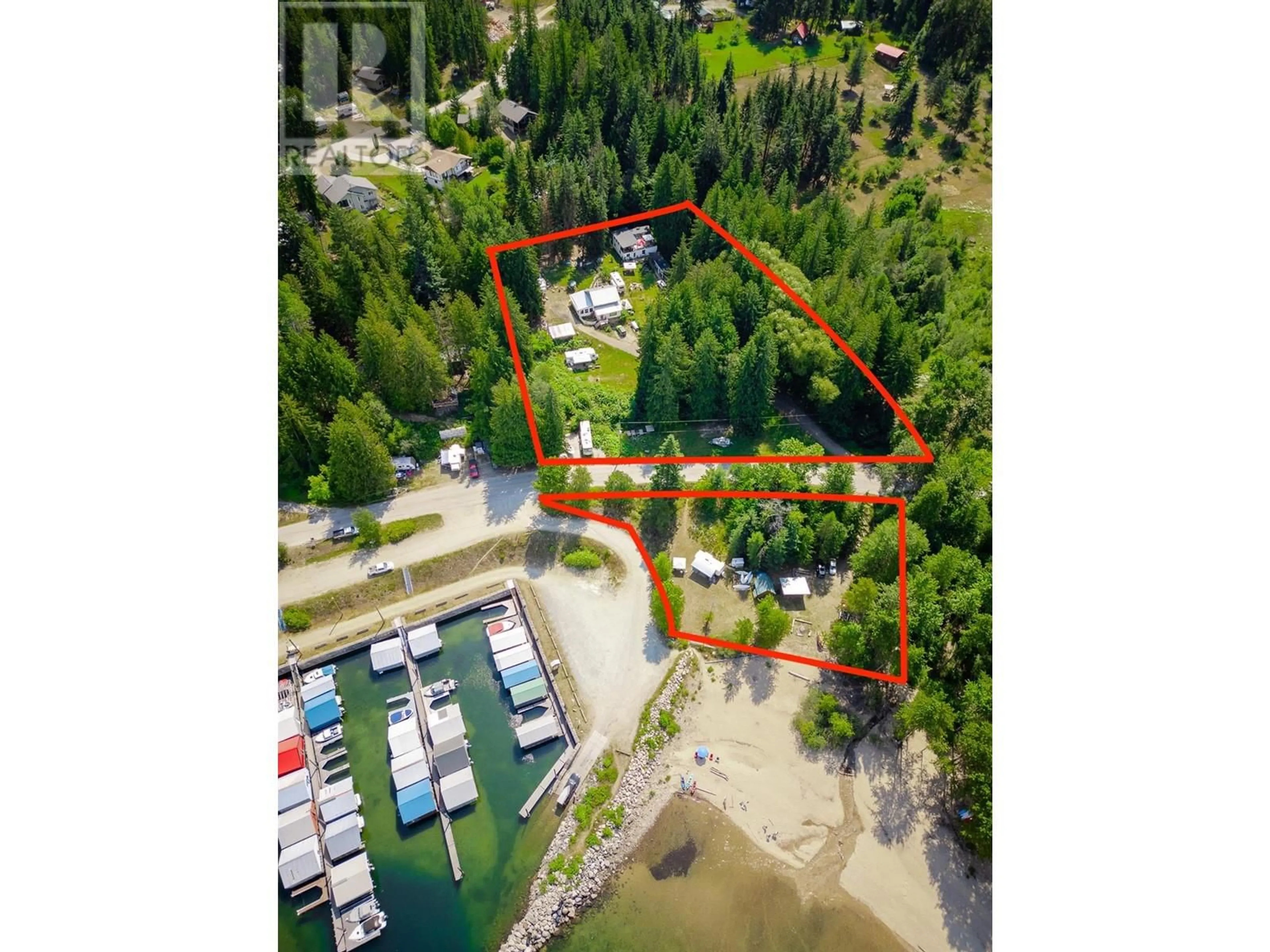 A pic from outside/outdoor area/front of a property/back of a property/a pic from drone, water/lake/river/ocean view for 1766 RIONDEL  N Road, Riondel British Columbia V0B2B0