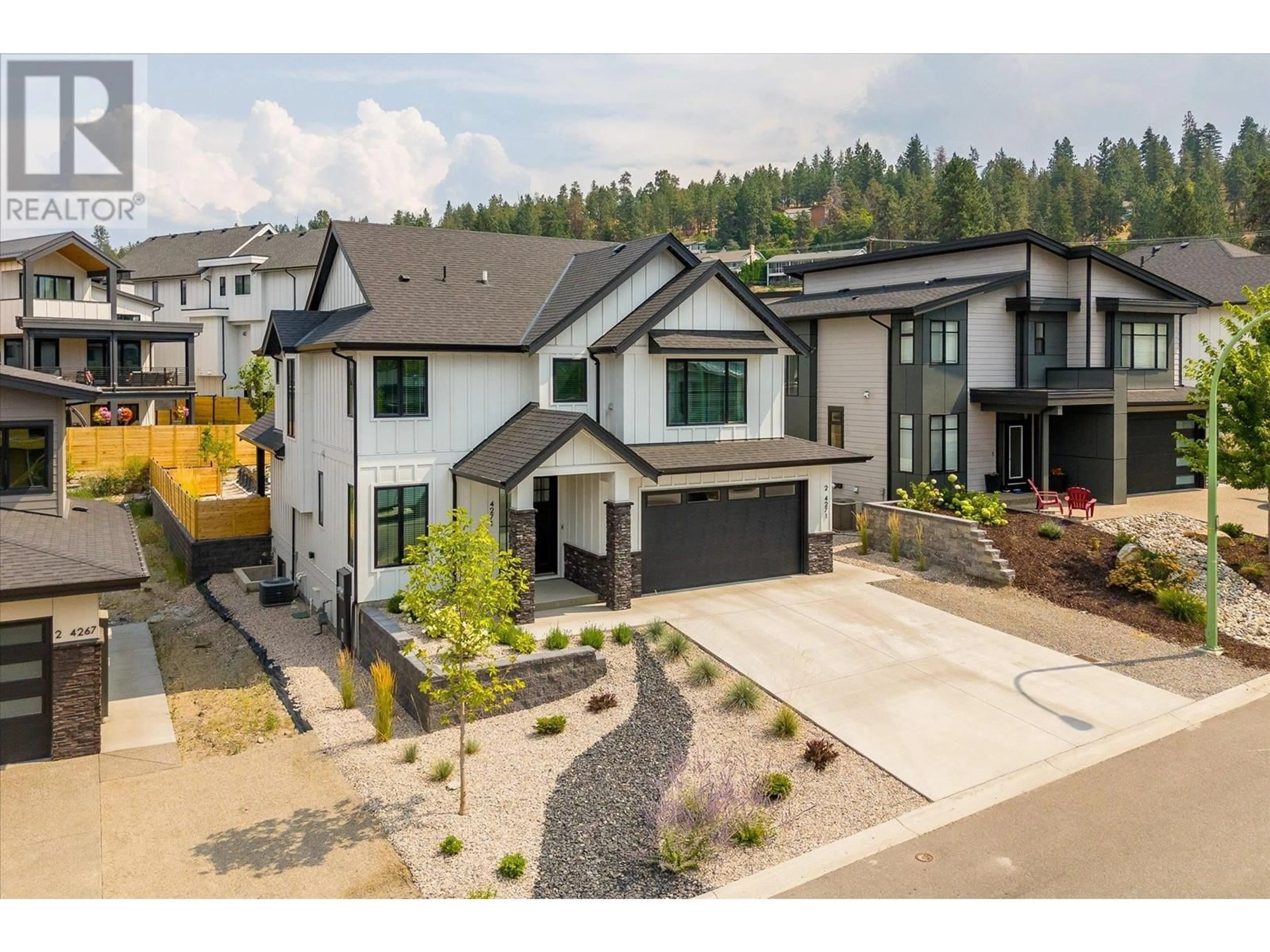 A pic from outside/outdoor area/front of a property/back of a property/a pic from drone, mountain view for 4271 Russo Street, Kelowna British Columbia V1W0C6