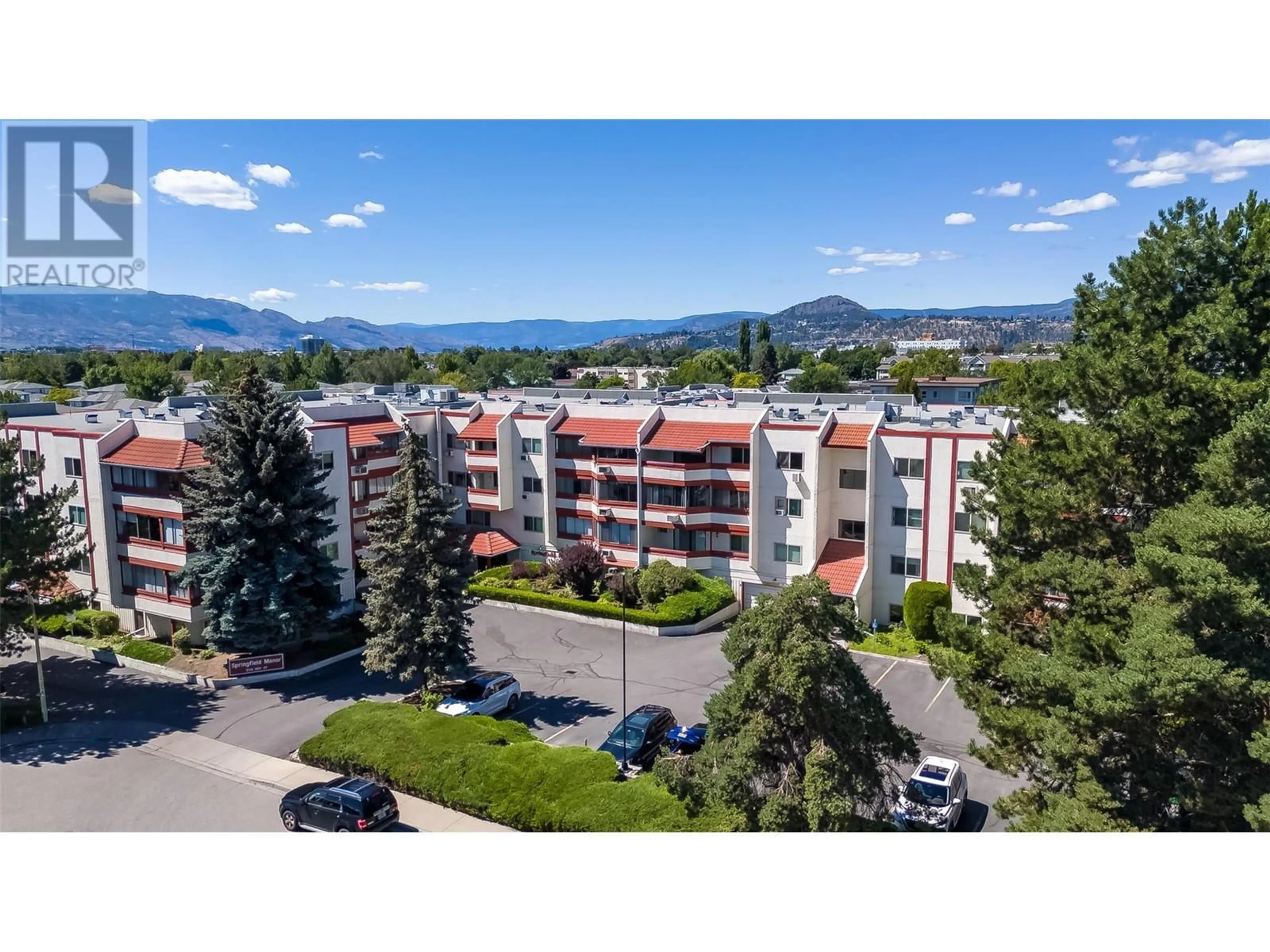 A pic from outside/outdoor area/front of a property/back of a property/a pic from drone, mountain view for 105 - 2110 HOY STREET, Kelowna British Columbia V1Y8T4