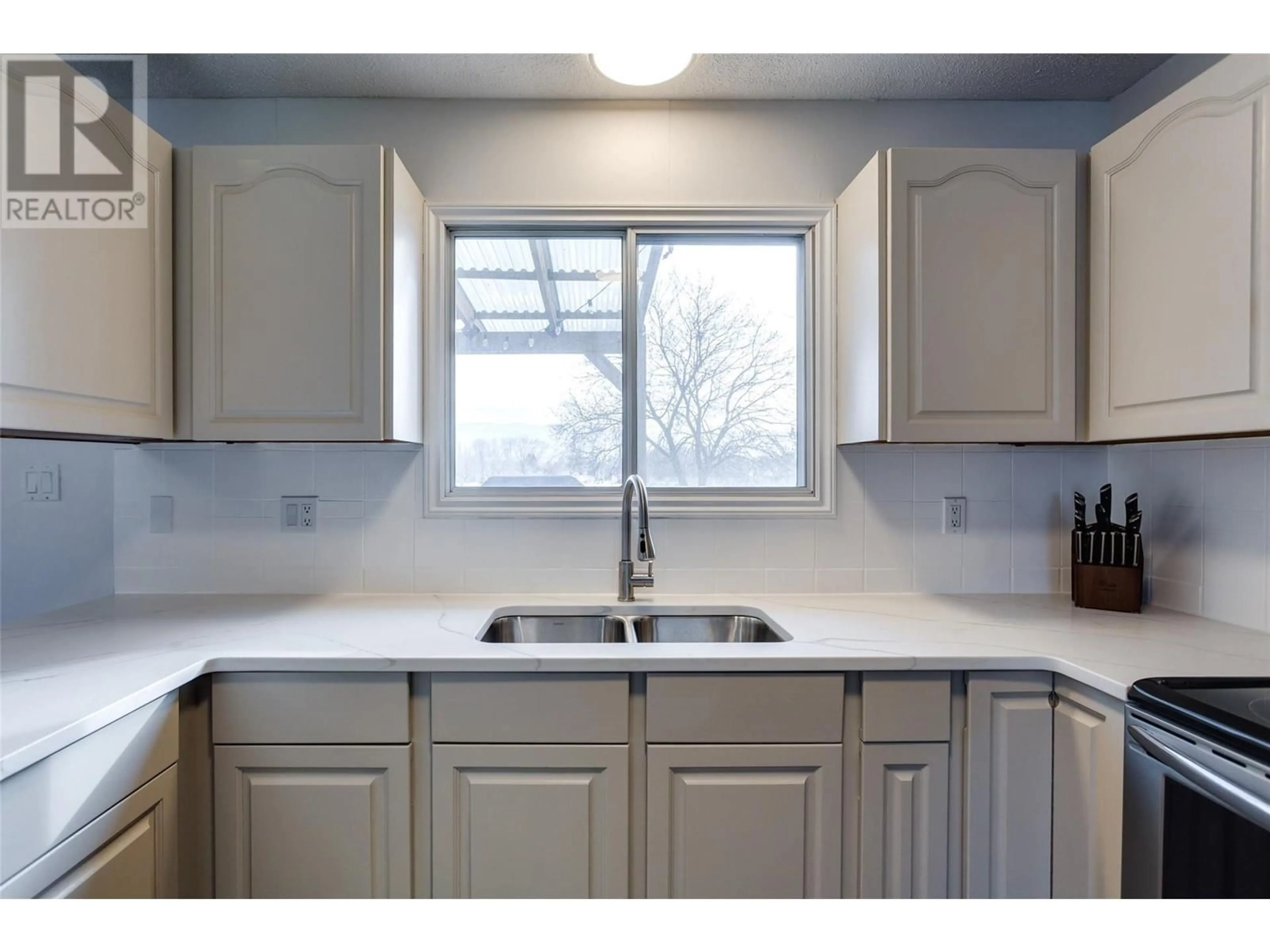 Standard kitchen, ceramic/tile floor for 485 Killarney Road, Kelowna British Columbia V1X5C6