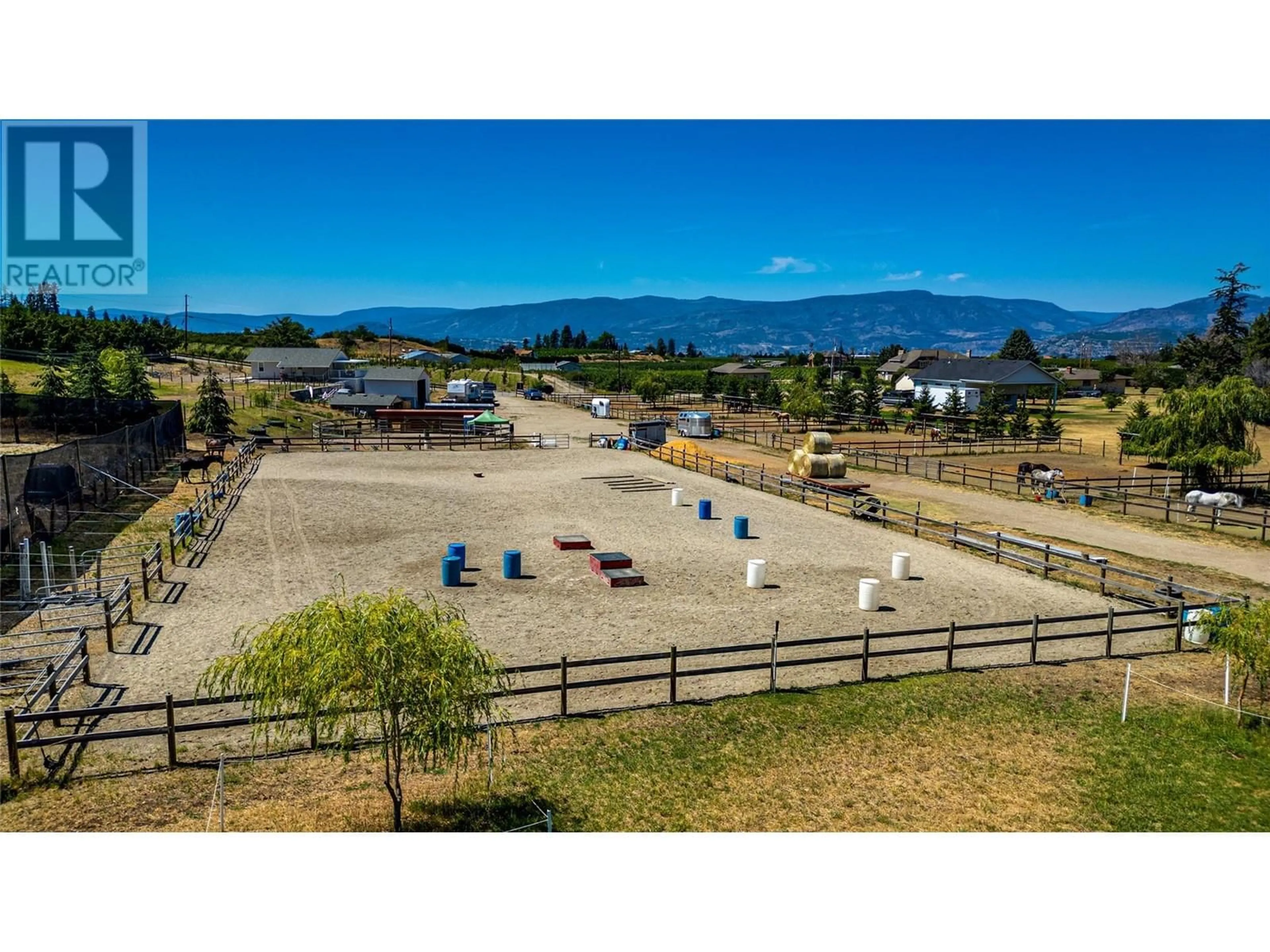 A pic from outside/outdoor area/front of a property/back of a property/a pic from drone, mountain view for 3990 Senger Road, Kelowna British Columbia V1W4S8