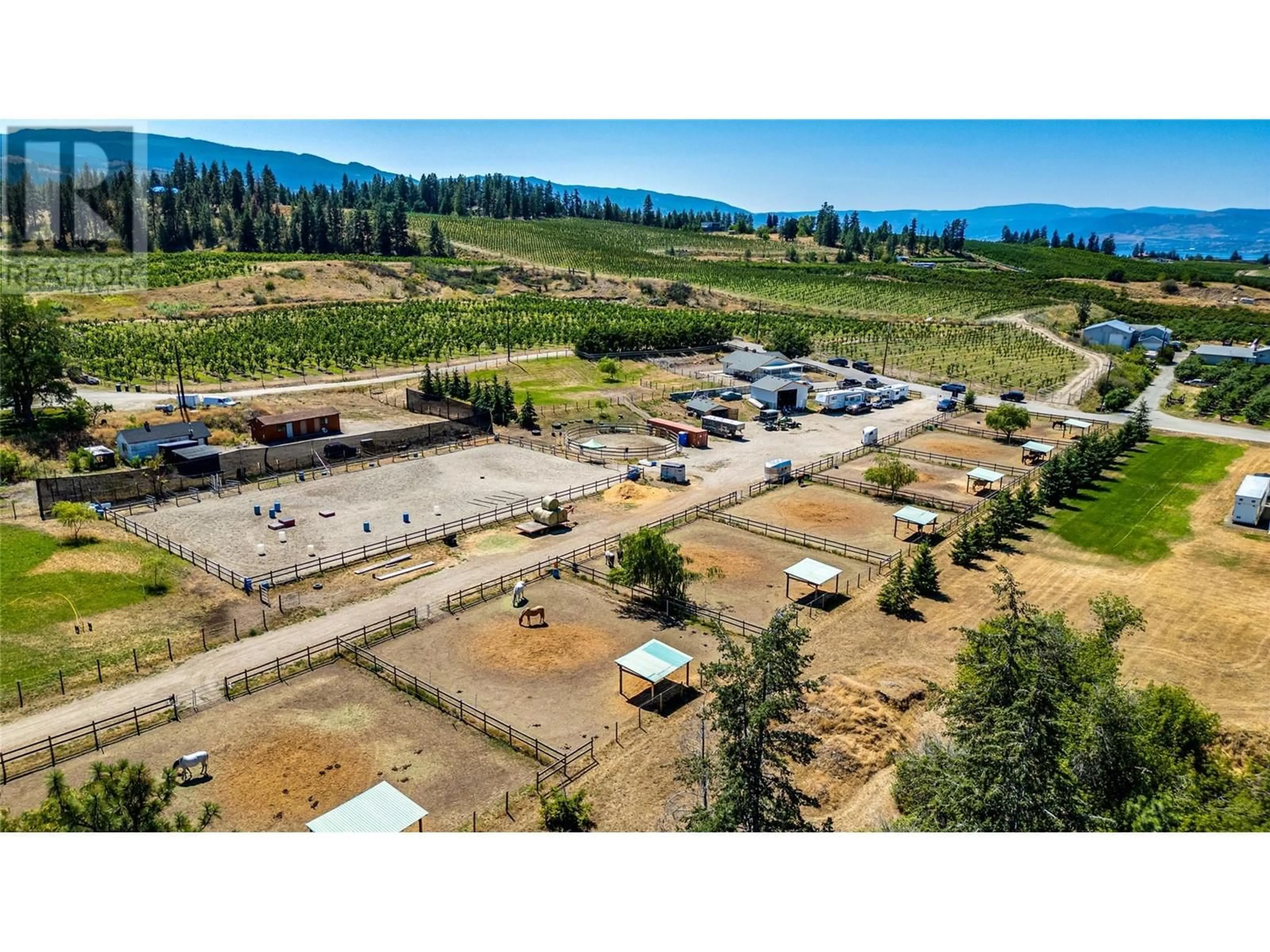 A pic from outside/outdoor area/front of a property/back of a property/a pic from drone, mountain view for 3990 Senger Road, Kelowna British Columbia V1W4S8